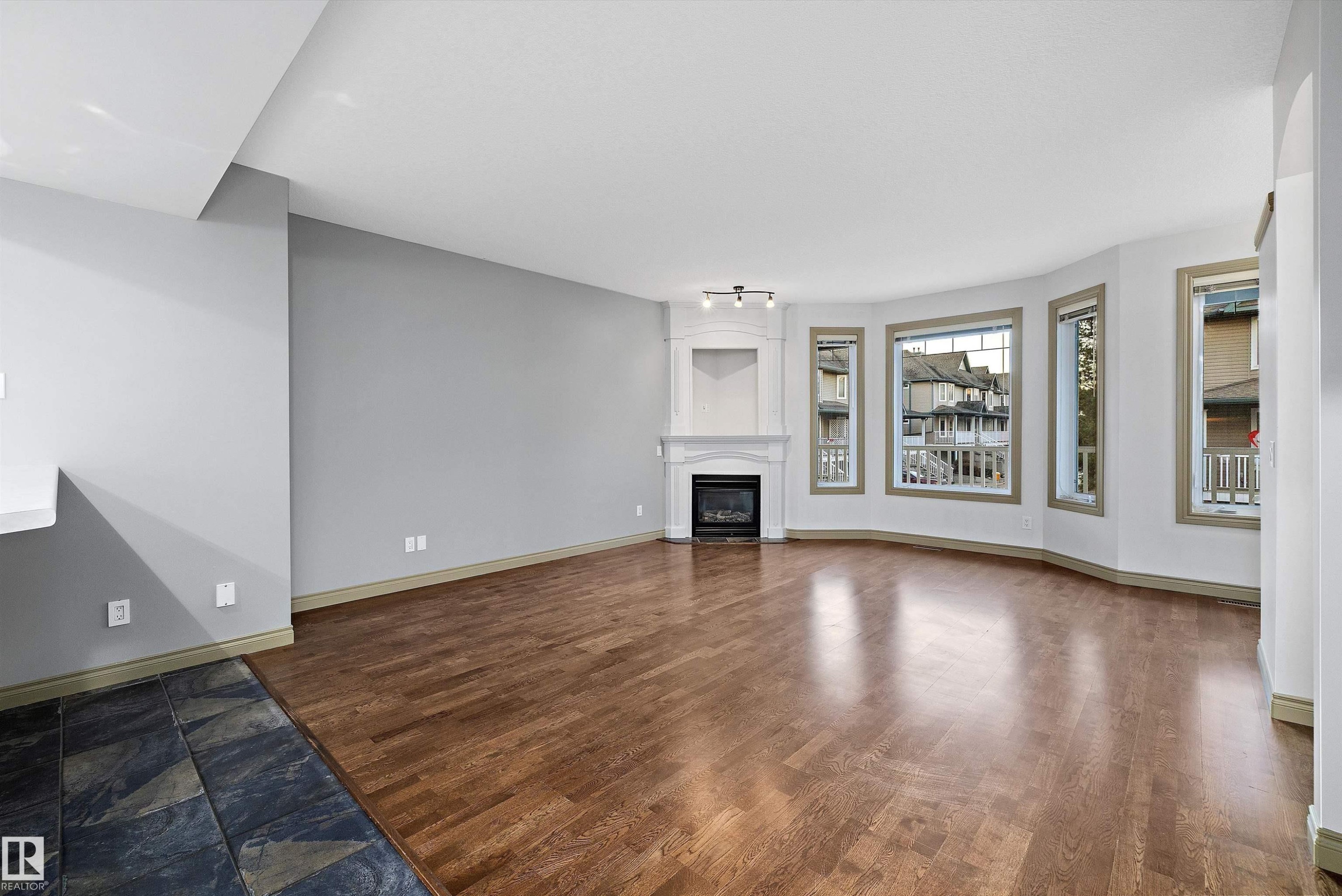17 903 Rutherford Road, Edmonton, AB - Indoor Photo Showing Living Room With Fireplace