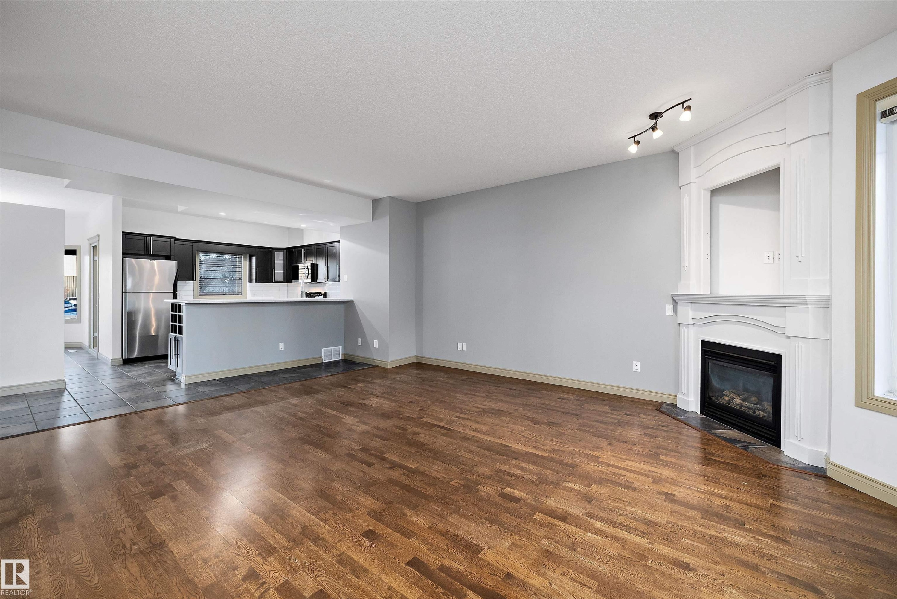 17 903 Rutherford Road, Edmonton, AB - Indoor Photo Showing Living Room With Fireplace