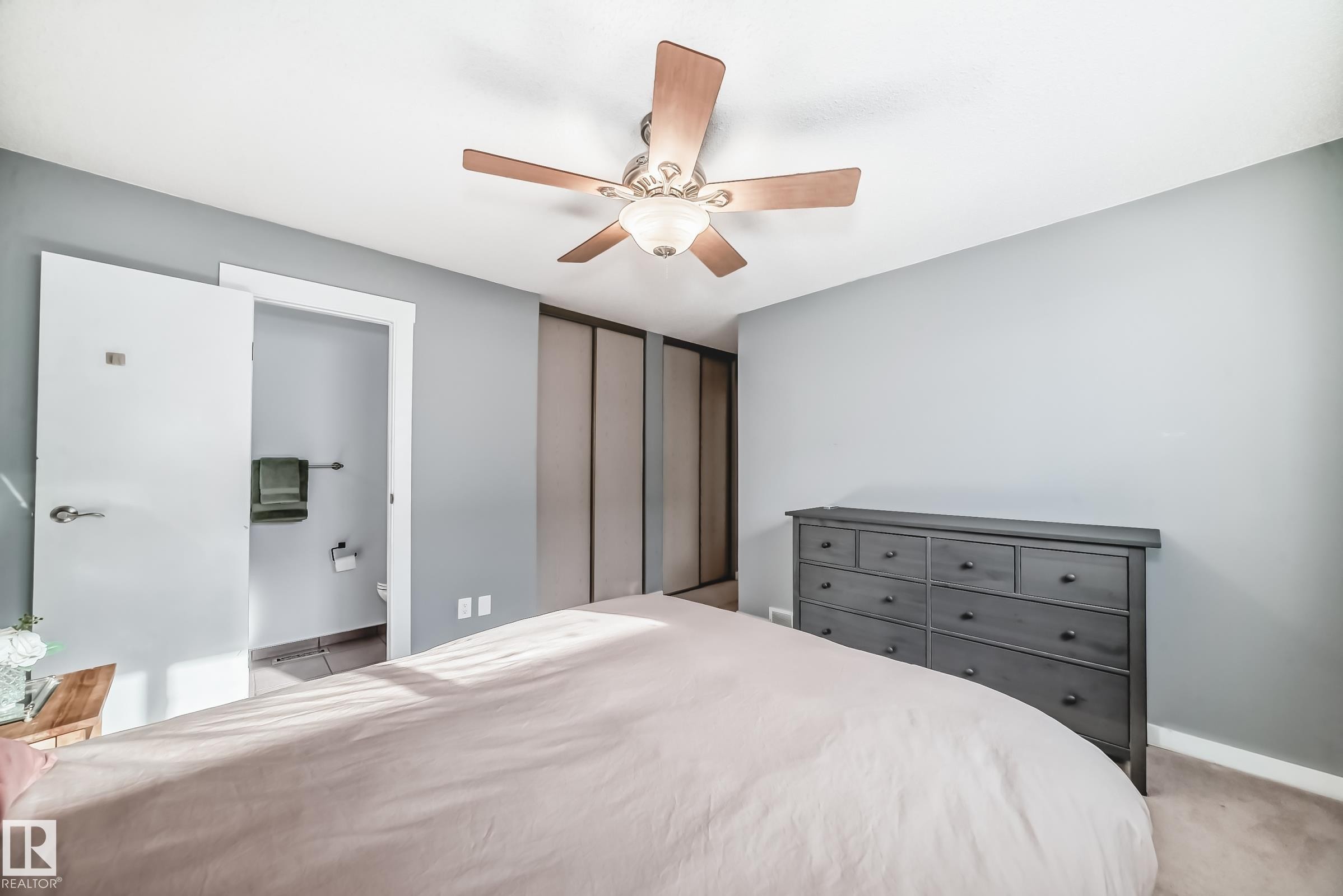 Bedroom featuring a ceiling fan and ensuite bath - 7011 190B Street, Edmonton, AB - Indoor Photo Showing Bedroom