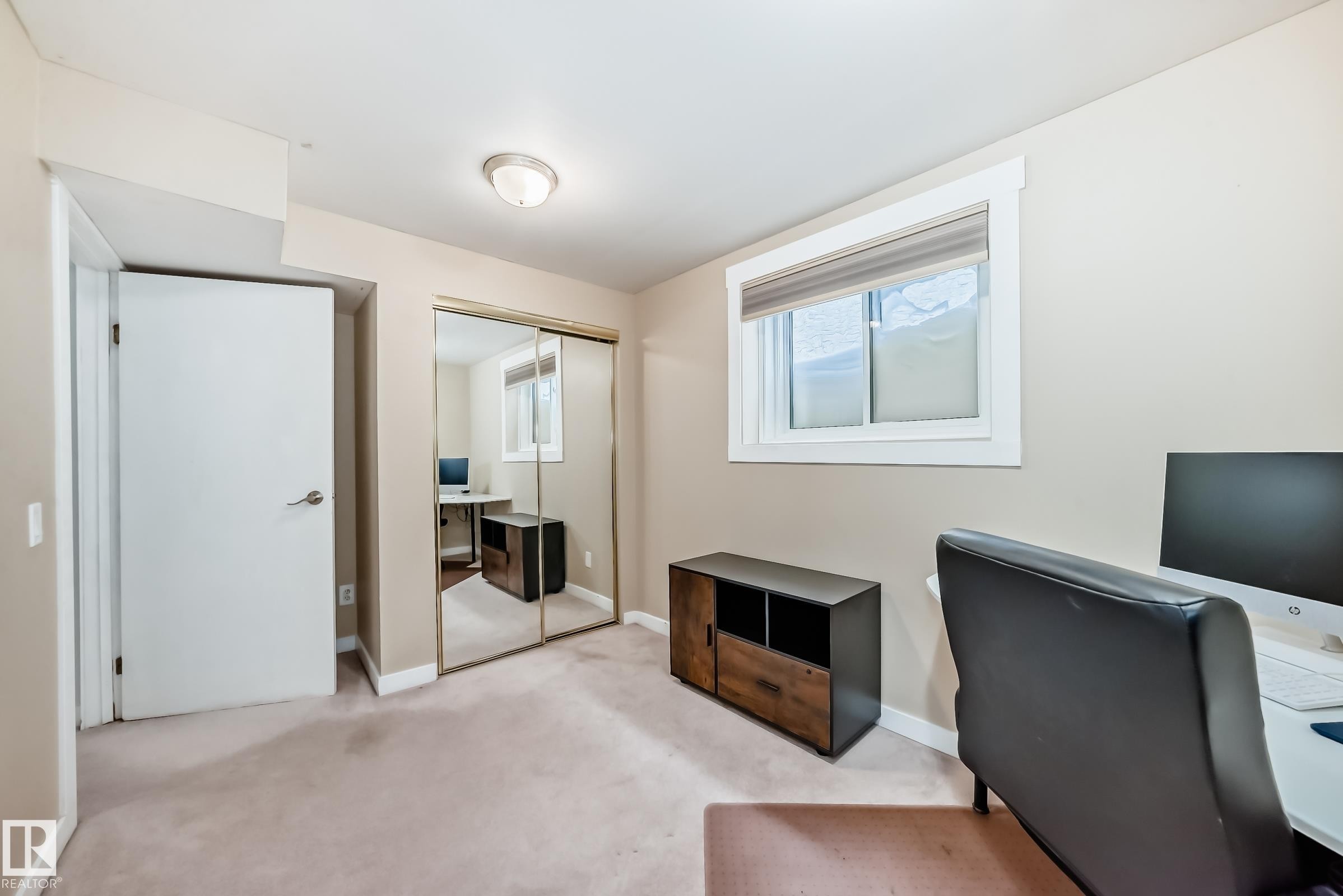 Office space featuring carpet flooring and baseboards - 7011 190B Street, Edmonton, AB - Indoor