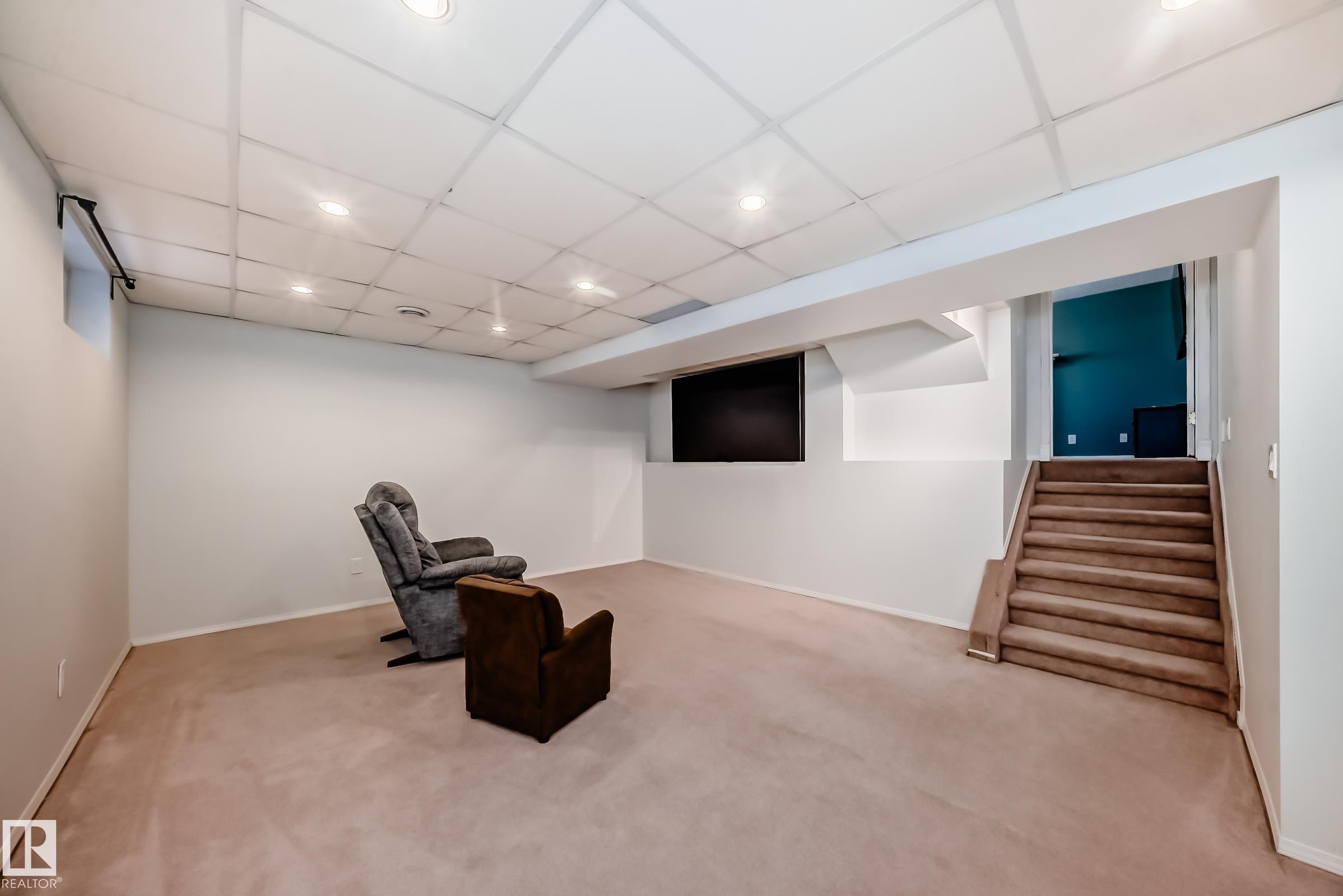 Unfurnished room featuring a paneled ceiling, carpet, and recessed lighting - 7011 190B Street, Edmonton, AB - Indoor
