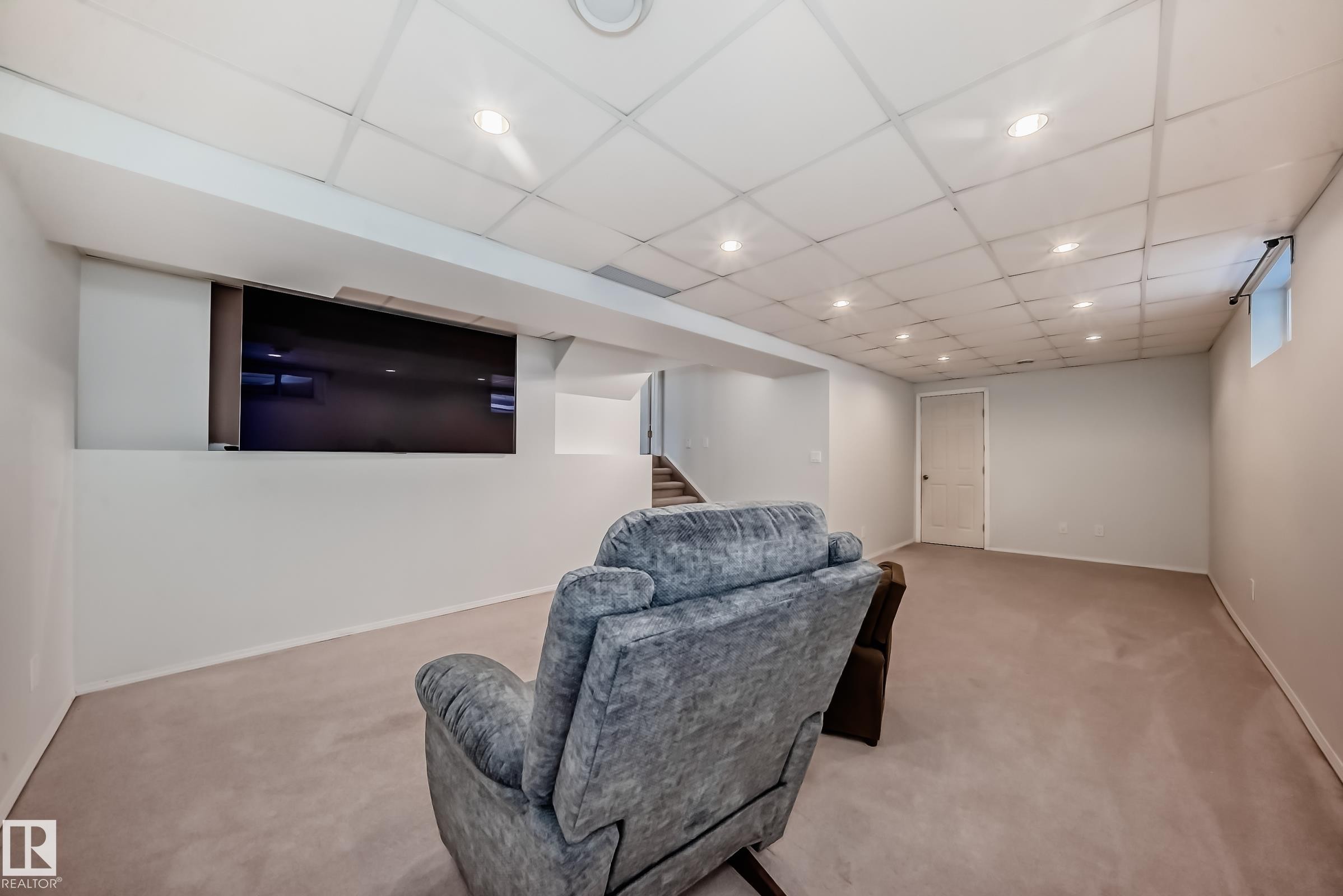 Sitting room with light colored carpet, a paneled ceiling, and recessed lighting - 7011 190B Street, Edmonton, AB - Indoor