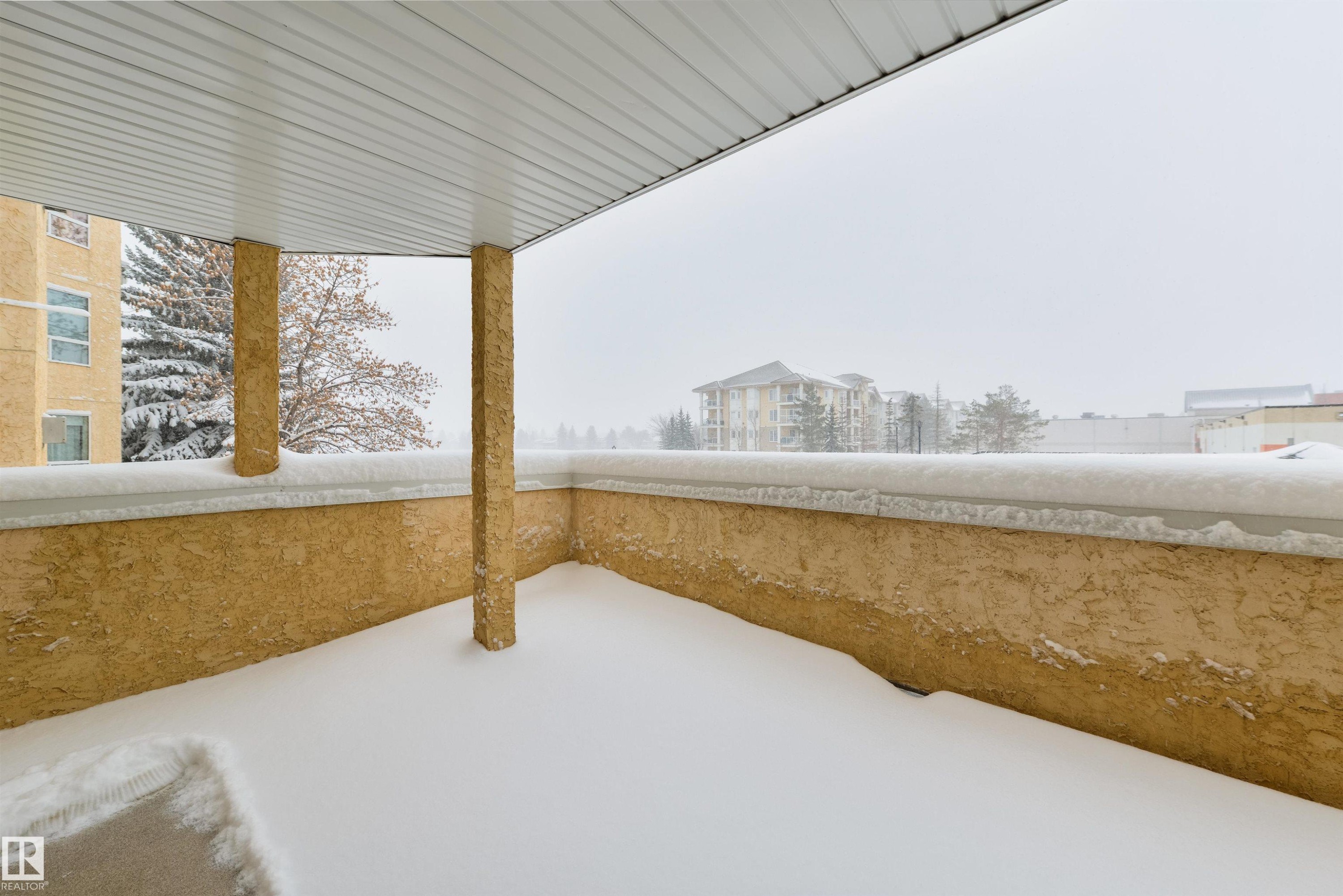 View of snow covered patio - 232 15499 Castle Downs Road, Edmonton, AB - Outdoor With Exterior