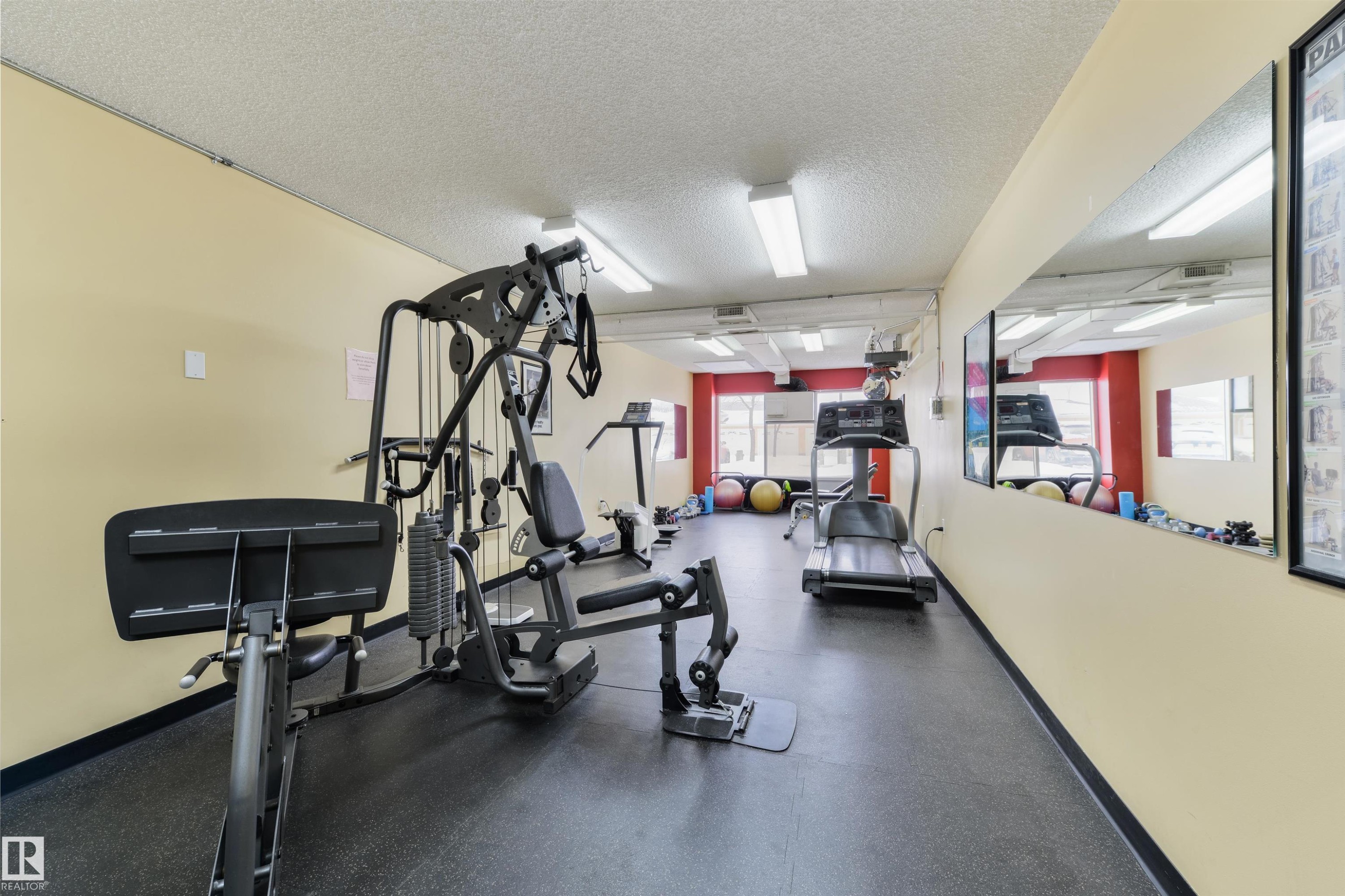 Gym with a textured ceiling - 232 15499 Castle Downs Road, Edmonton, AB - Indoor Photo Showing Gym Room