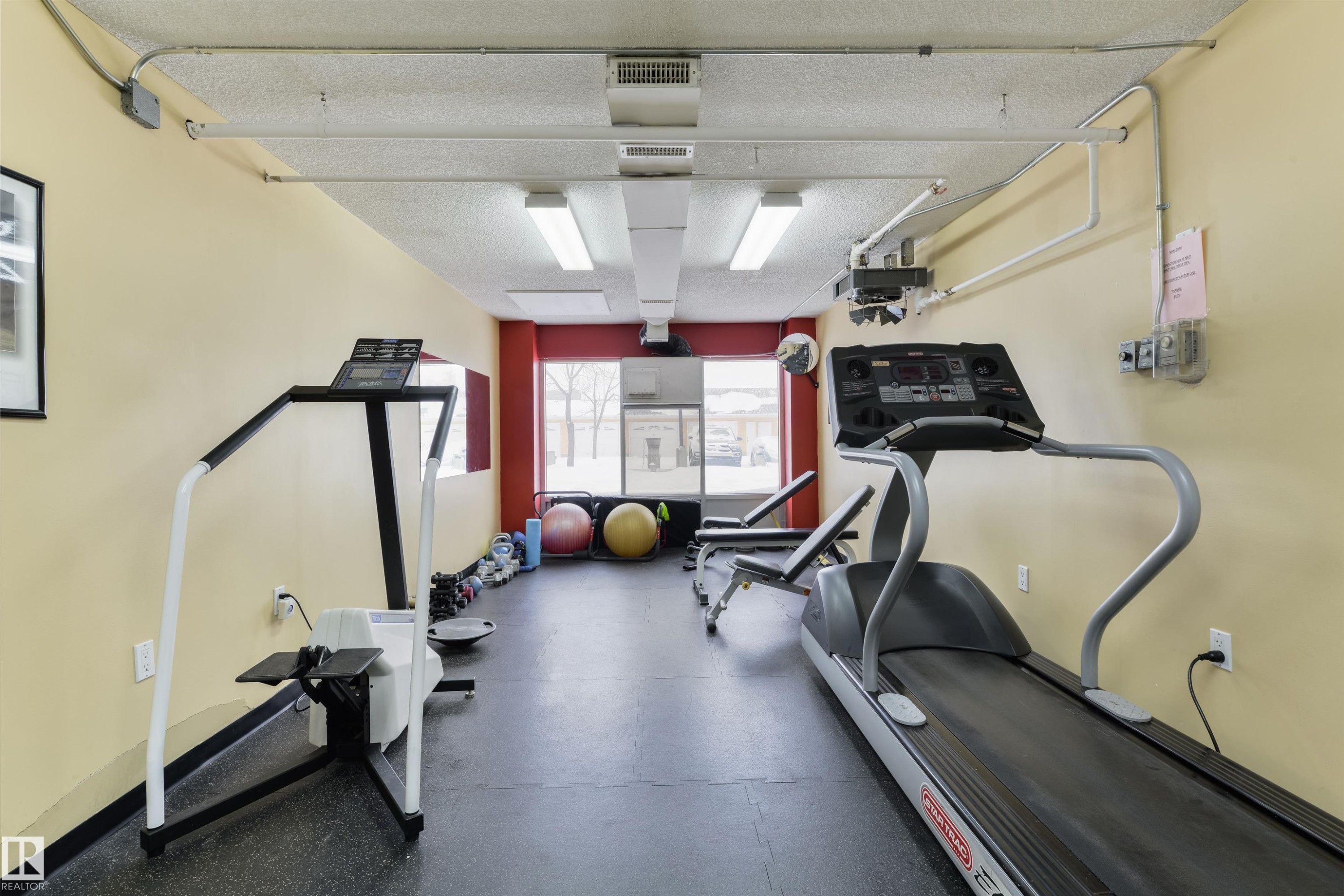Exercise area featuring a textured ceiling - 232 15499 Castle Downs Road, Edmonton, AB - Indoor Photo Showing Gym Room