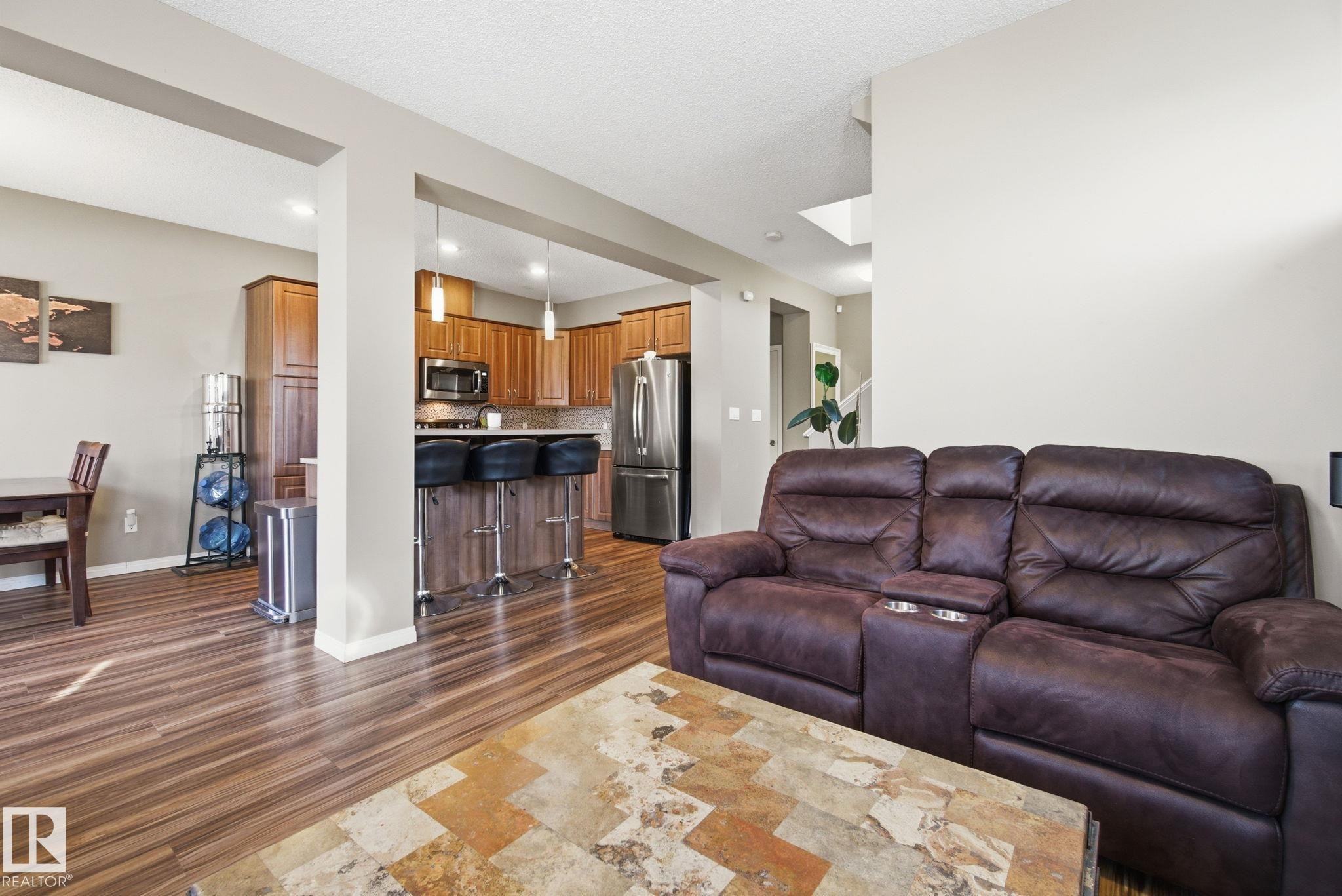 Living room with dark wood finished floors and baseboards - 3087 Arthurs Crescent, Edmonton, AB - Indoor Photo Showing Living Room