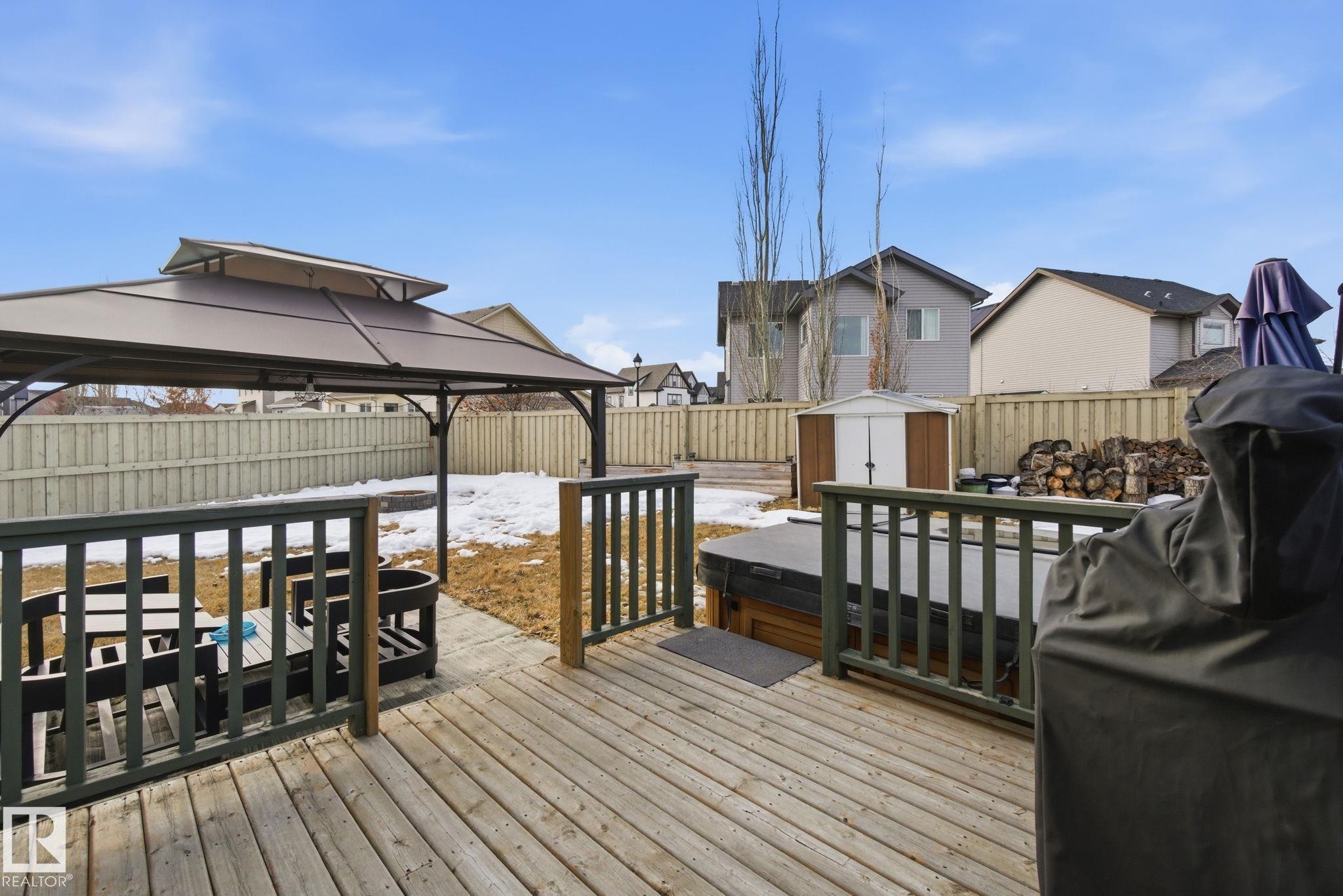 Wooden terrace featuring a storage shed, a residential view, area for grilling, a fenced backyard, and a gazebo - 3087 Arthurs Crescent, Edmonton, AB - Outdoor With Deck Patio Veranda With Exterior