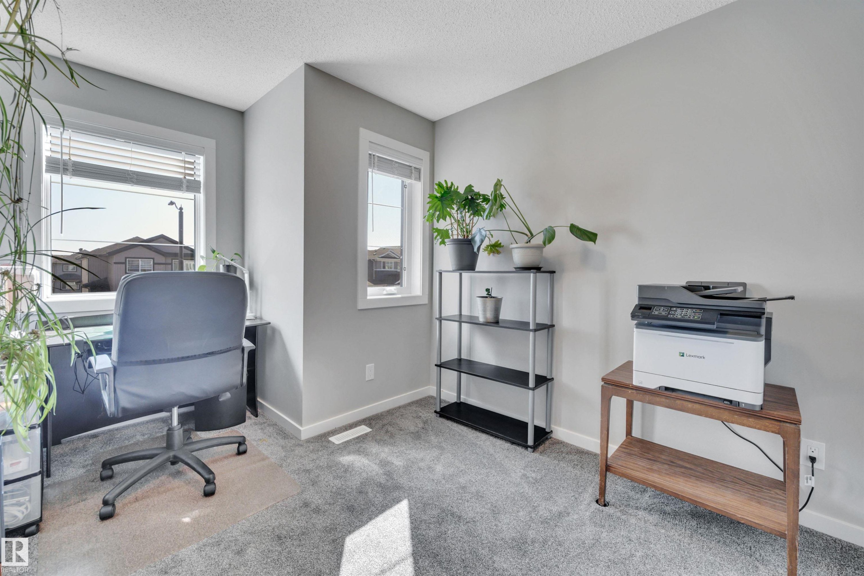 Home office featuring light colored carpet and a textured ceiling - 157 Larch Crescent, Leduc, AB - Indoor
