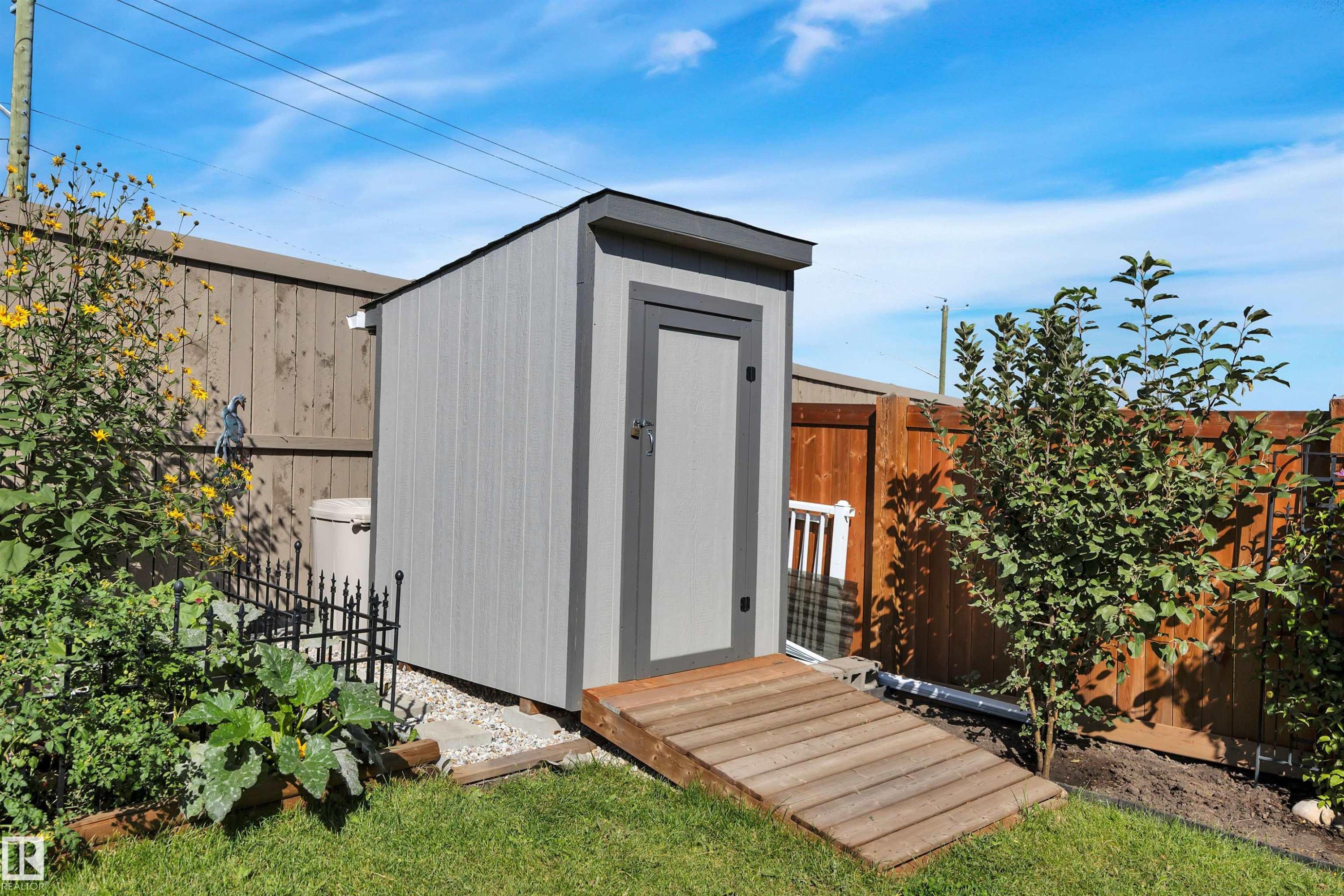 View of shed featuring a fenced backyard - 157 Larch Crescent, Leduc, AB - Outdoor