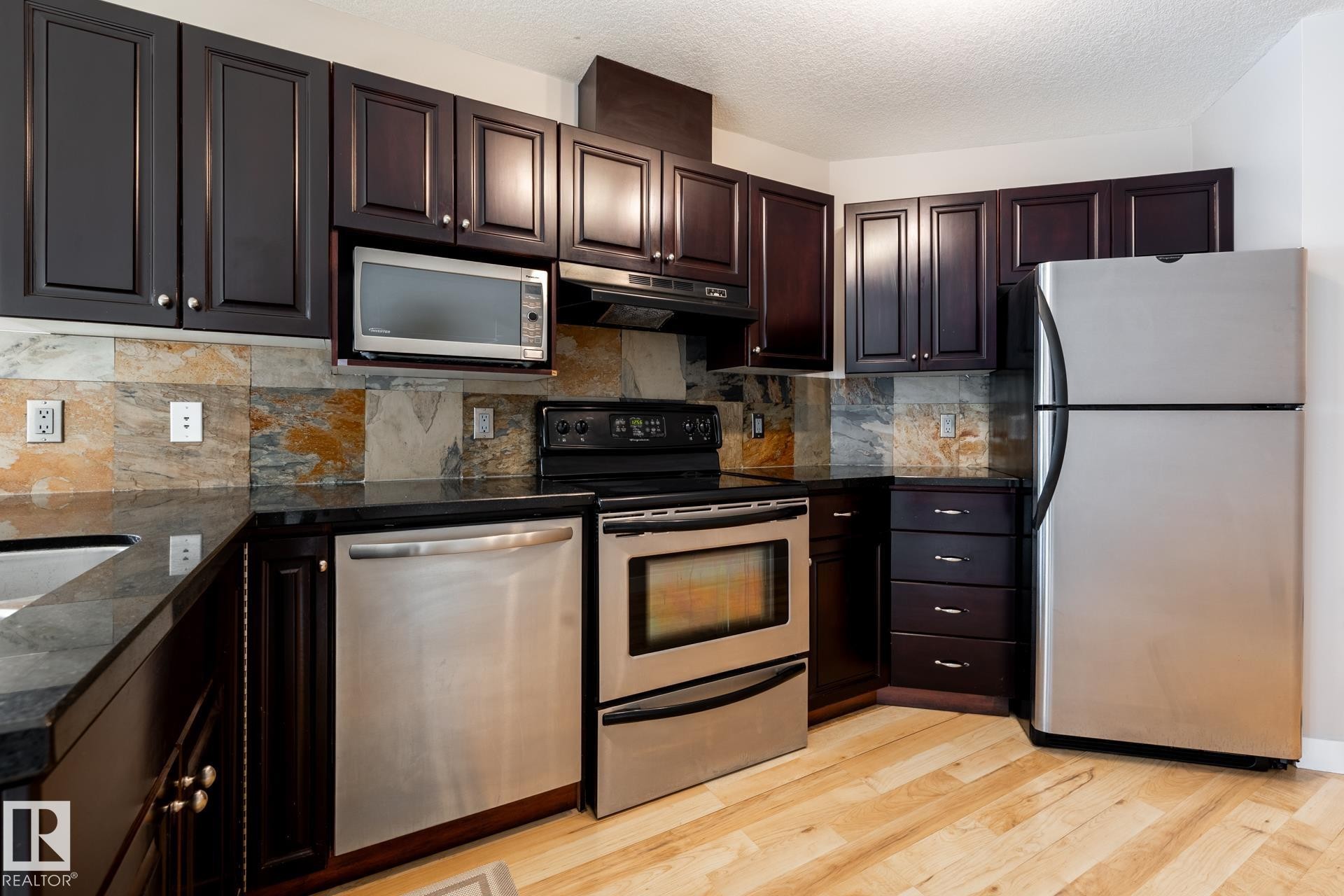 304 9336 Jasper Avenue, Edmonton, AB - Indoor Photo Showing Kitchen With Double Sink