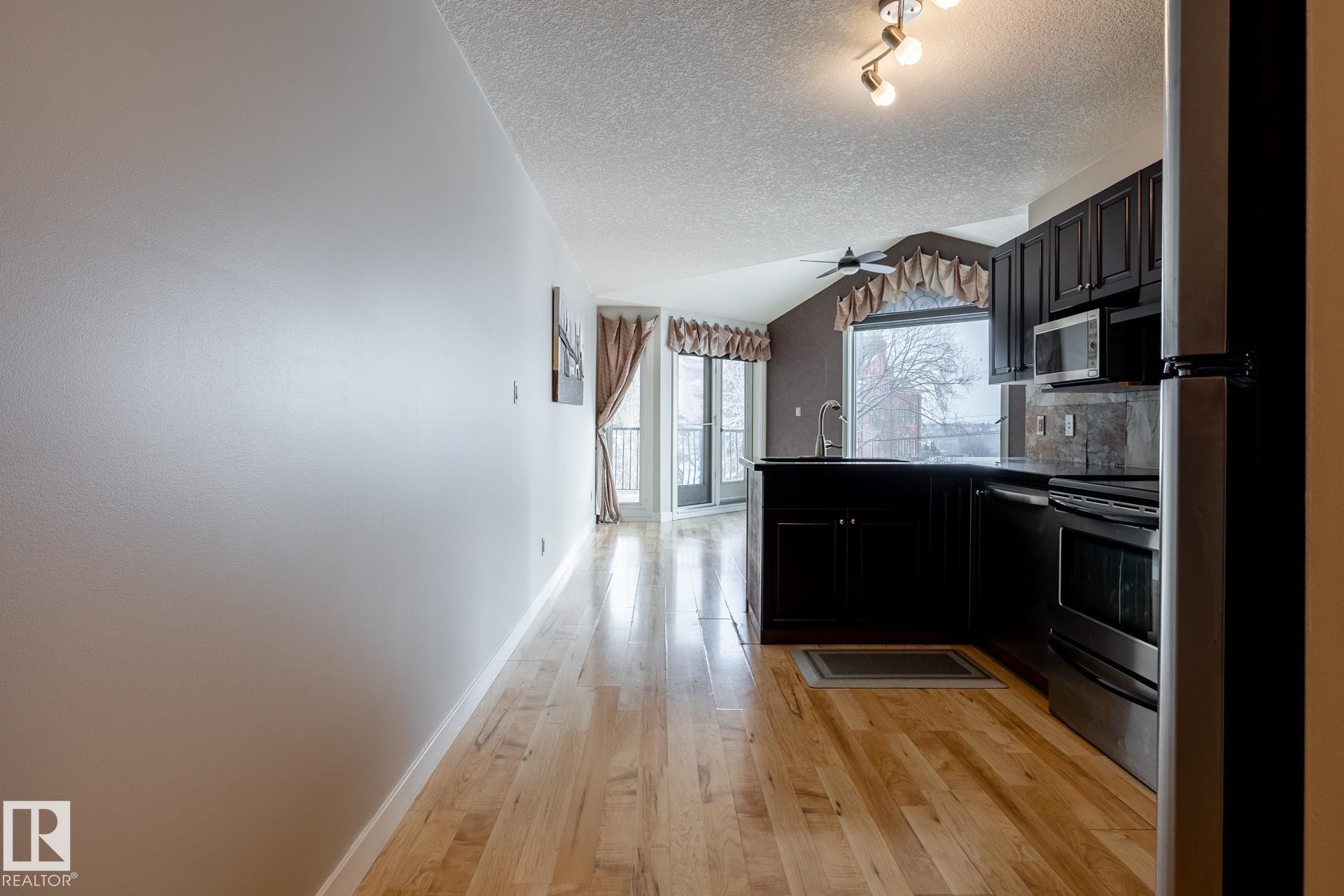 304 9336 Jasper Avenue, Edmonton, AB - Indoor Photo Showing Kitchen With Stainless Steel Kitchen