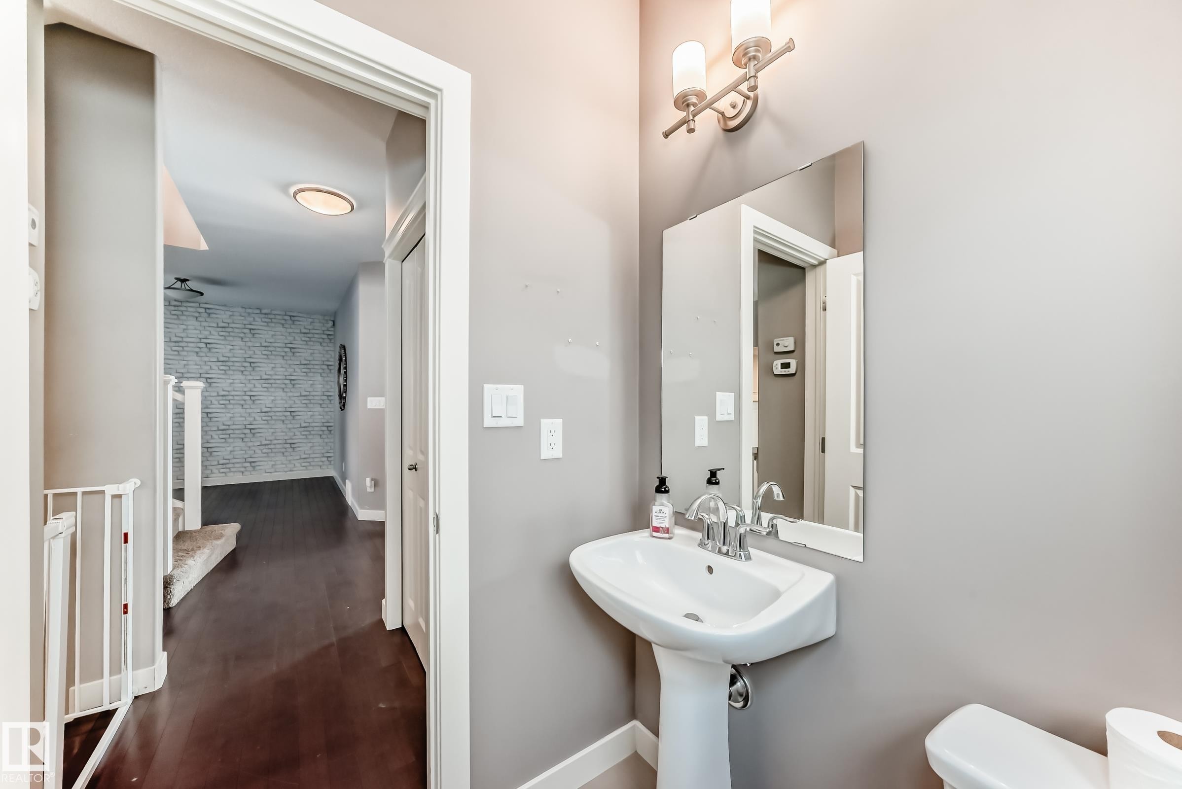 Bathroom featuring toilet and baseboards - 1908 69 Street, Edmonton, AB - Indoor Photo Showing Bathroom