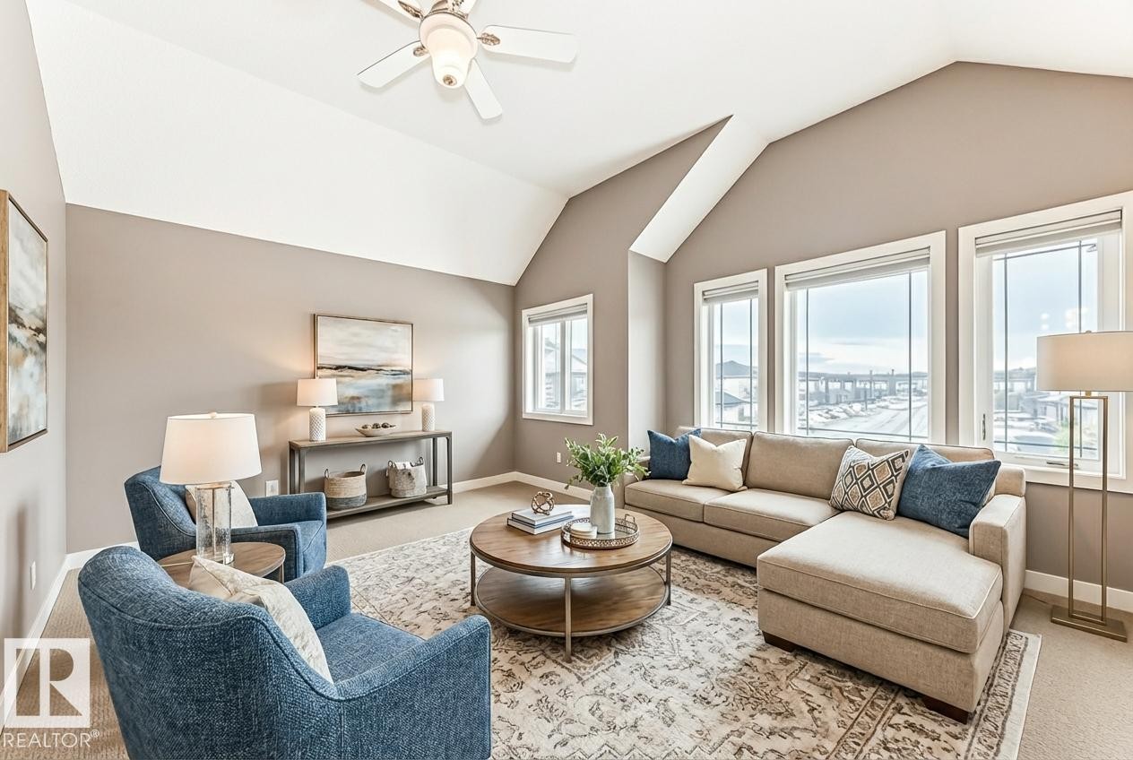 Living room with carpet floors and ceiling fan - 1908 69 Street, Edmonton, AB - Indoor Photo Showing Living Room