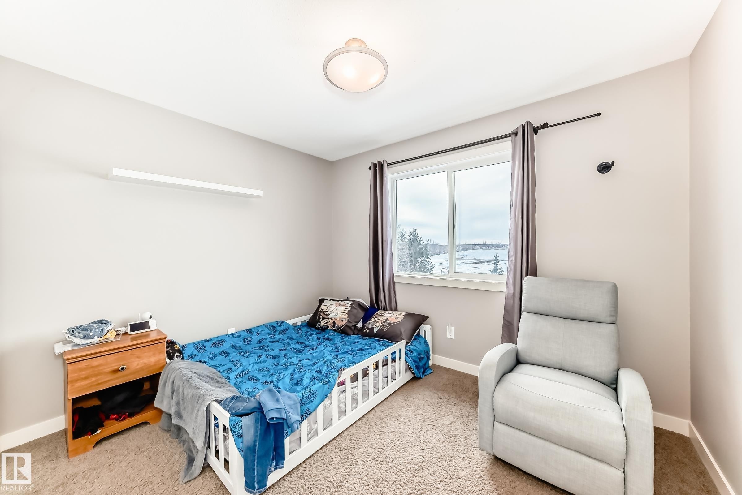 Bedroom with baseboards and carpet flooring - 1908 69 Street, Edmonton, AB - Indoor Photo Showing Bedroom