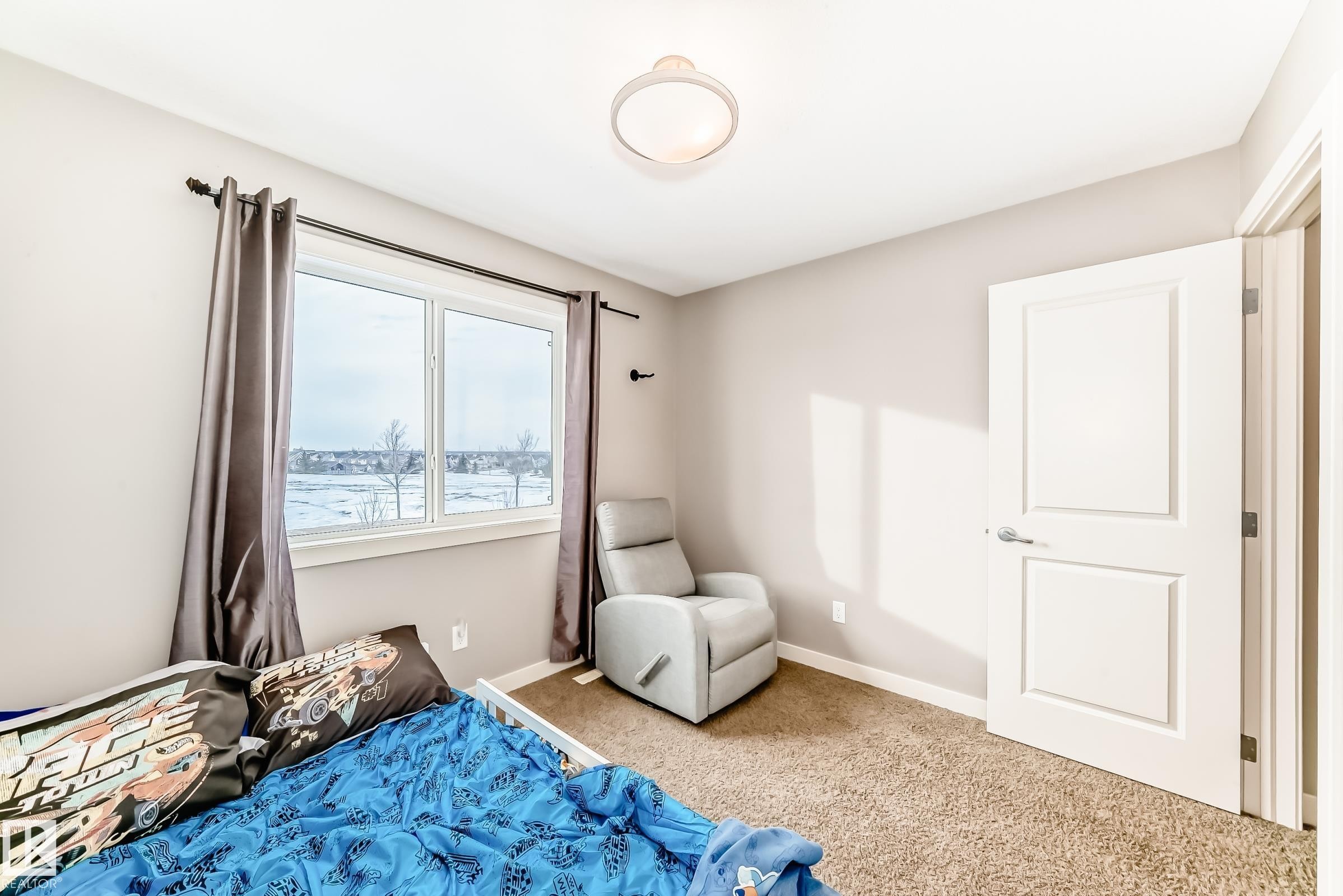 Carpeted bedroom with baseboards - 1908 69 Street, Edmonton, AB - Indoor Photo Showing Bedroom