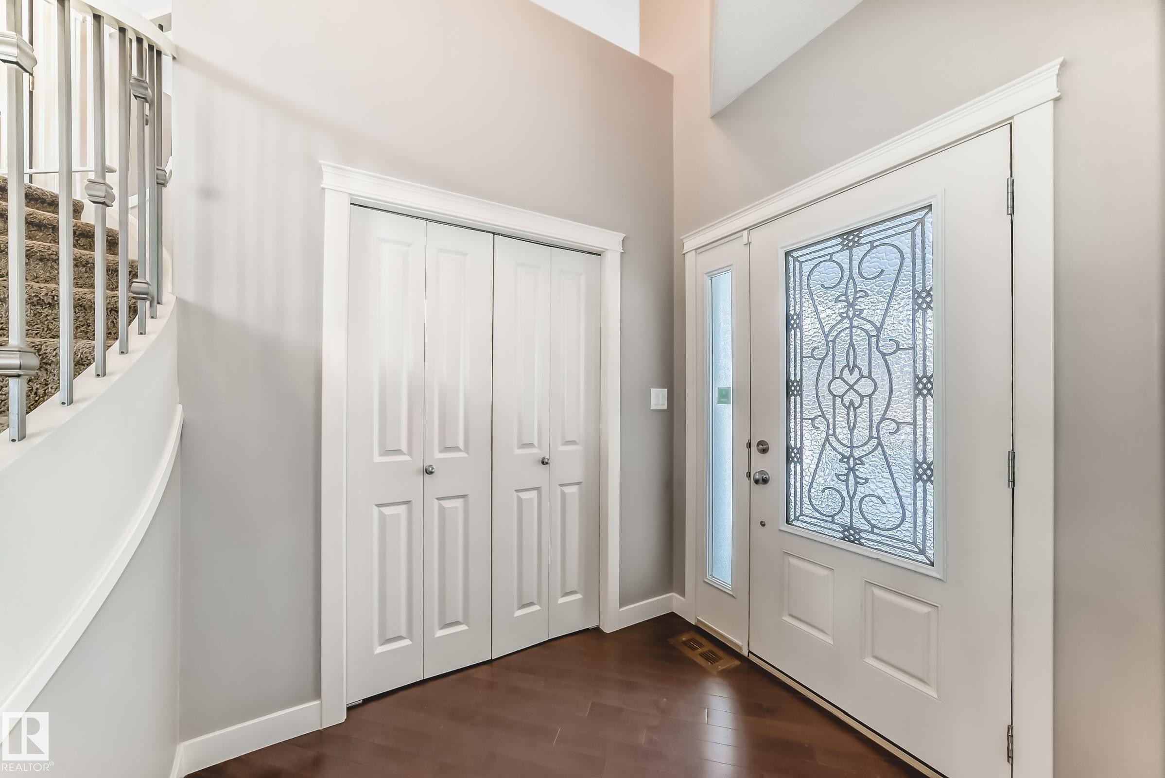 Foyer entrance with dark wood finished floors and stairway - 1908 69 Street, Edmonton, AB - Indoor Photo Showing Other Room