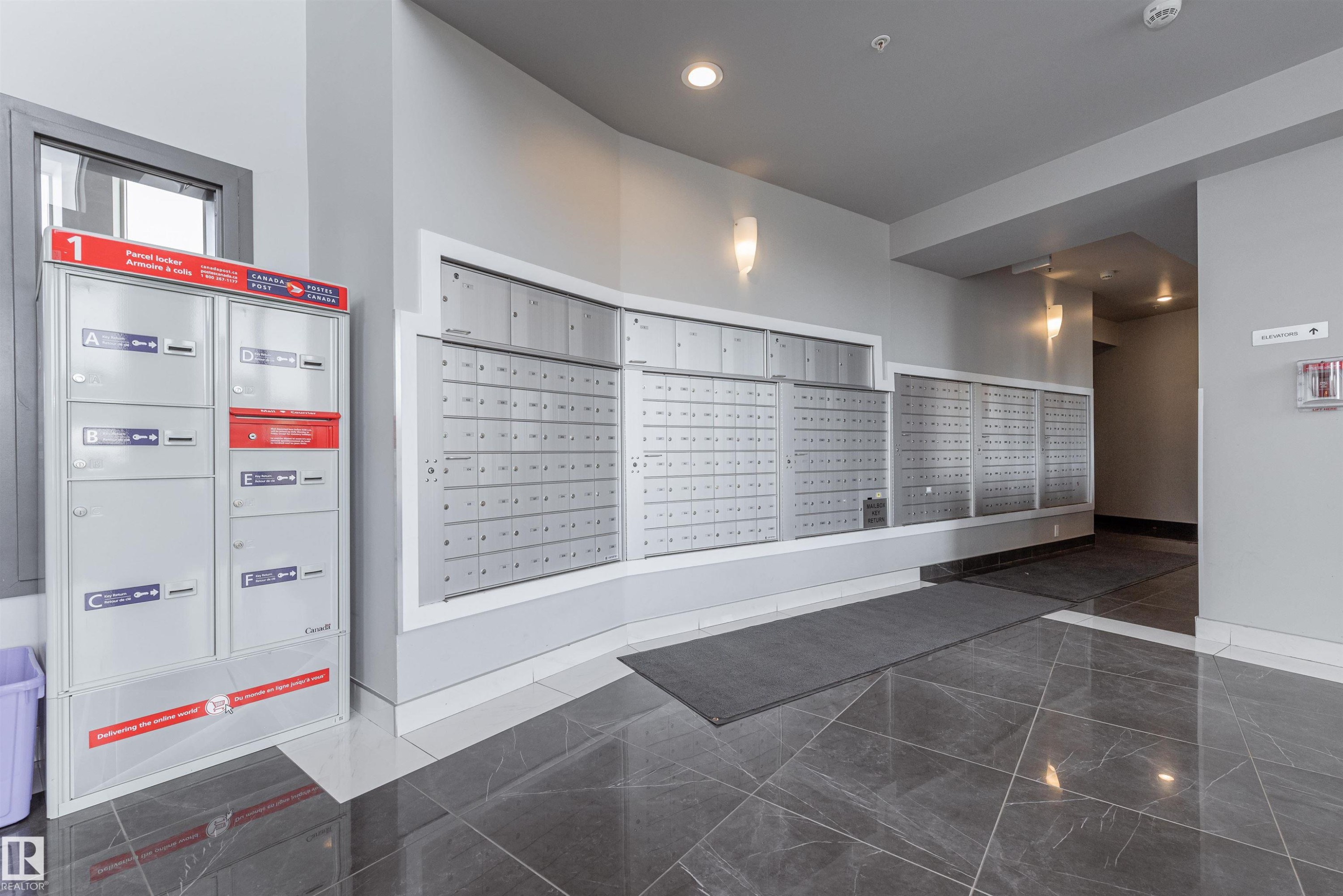 View of community featuring mail area and recessed lighting - 332 5151 Windermere Boulevard, Edmonton, AB - Indoor Photo Showing Other Room