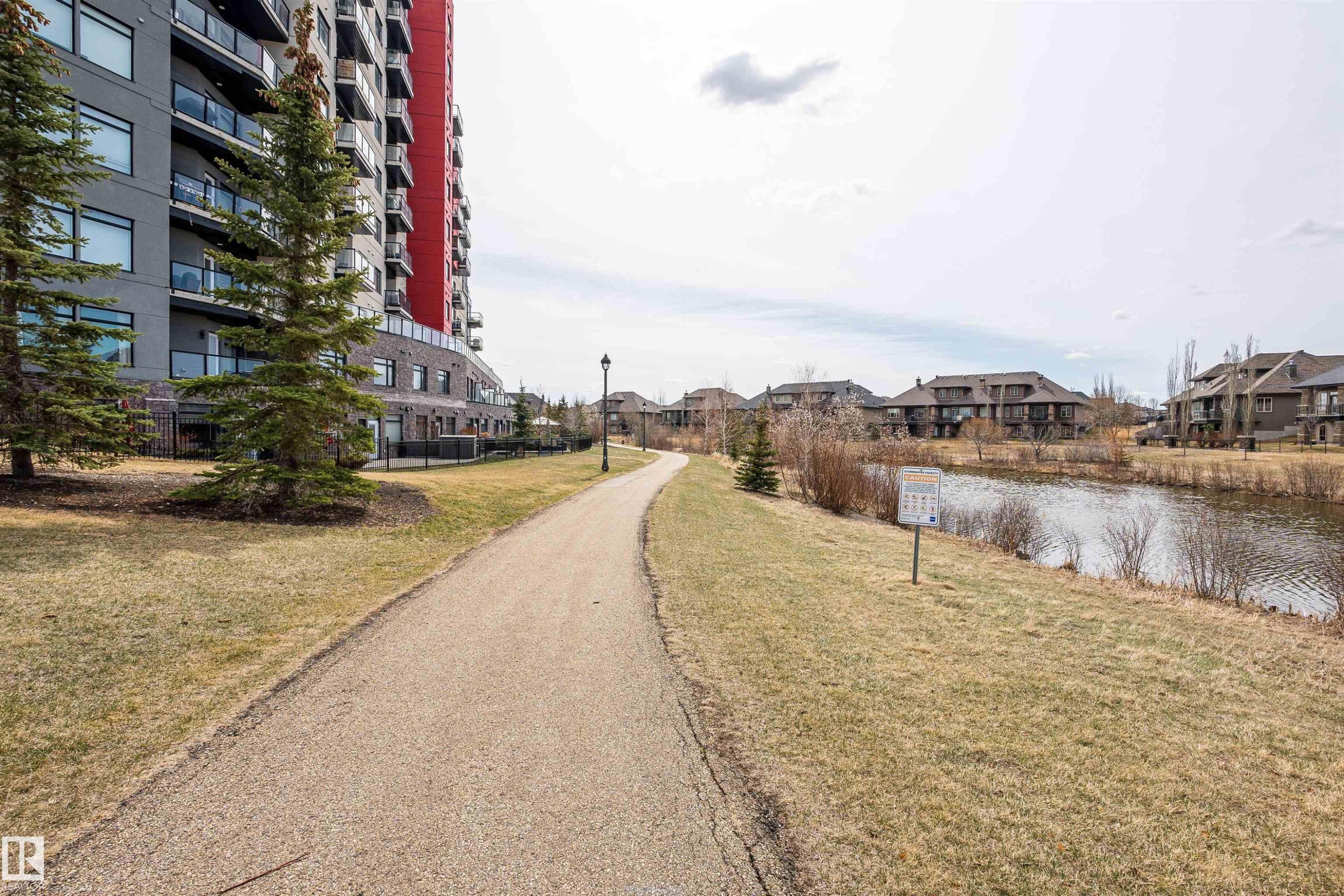 View of street featuring a residential view and a water view - 332 5151 Windermere Boulevard, Edmonton, AB - Outdoor