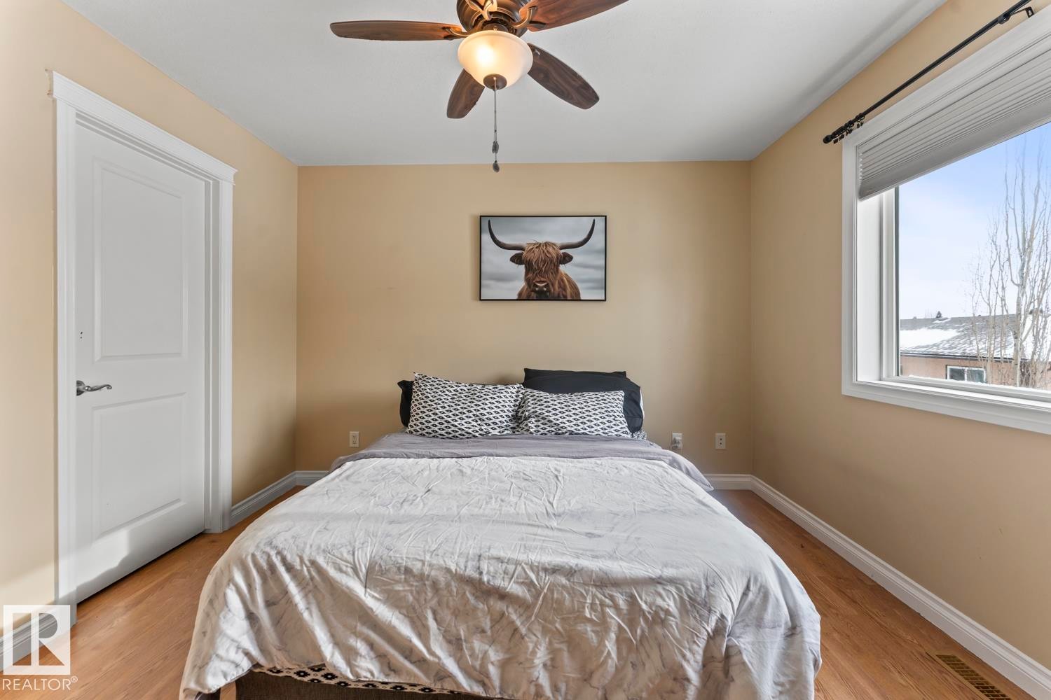 Bedroom featuring a ceiling fan and light wood finished floors - 7 1001 7 Avenue, Cold Lake, AB - Indoor Photo Showing Bedroom