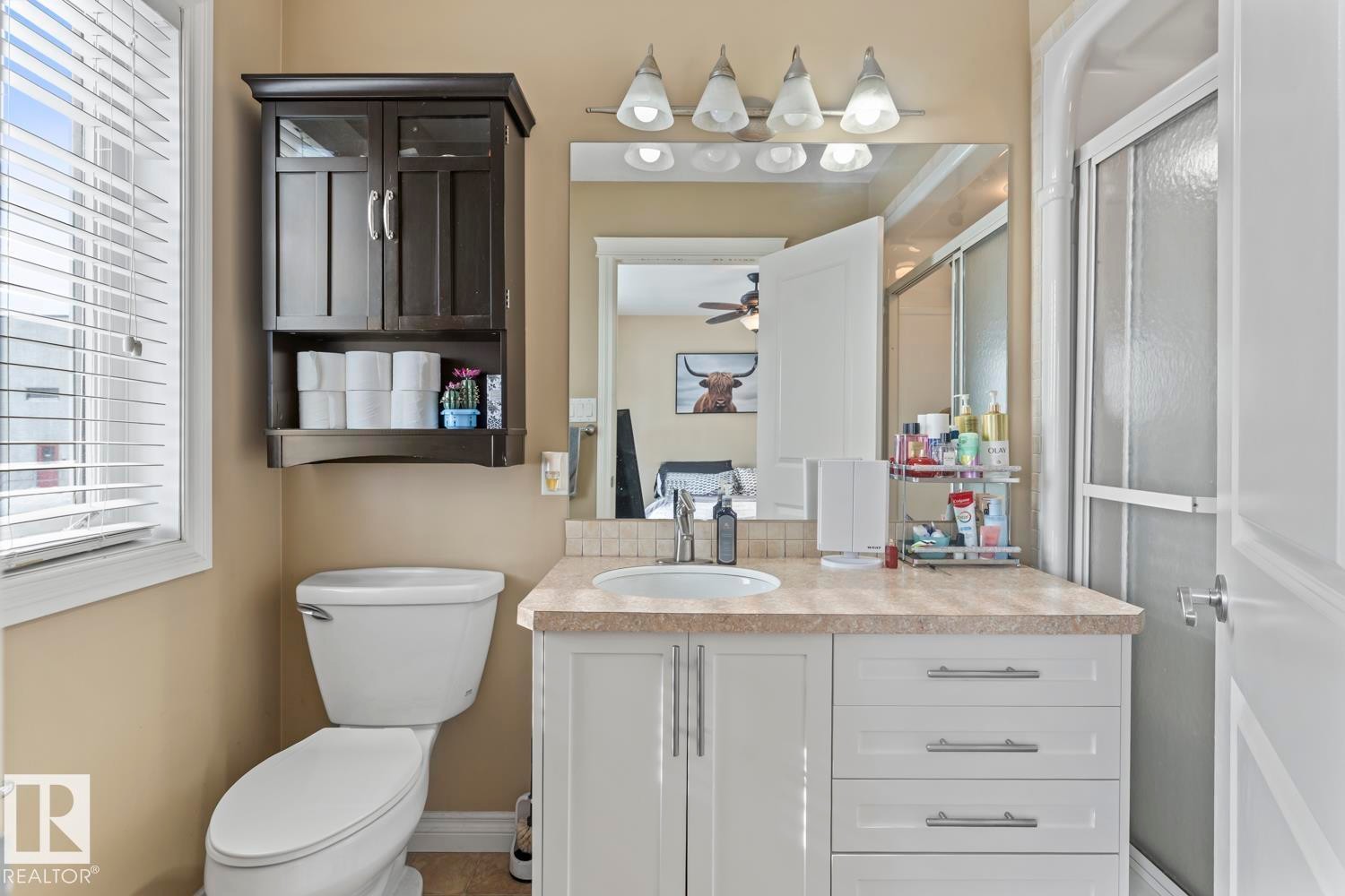 Bathroom featuring vanity and a shower with door - 7 1001 7 Avenue, Cold Lake, AB - Indoor Photo Showing Bathroom