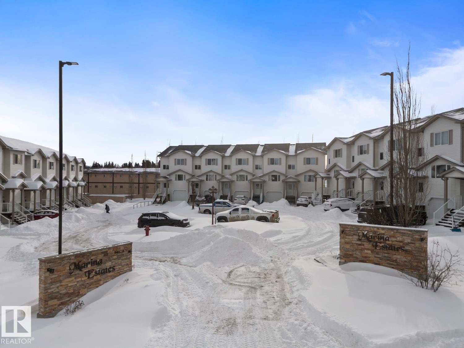 View of community with a residential view - 7 1001 7 Avenue, Cold Lake, AB - Outdoor With Facade