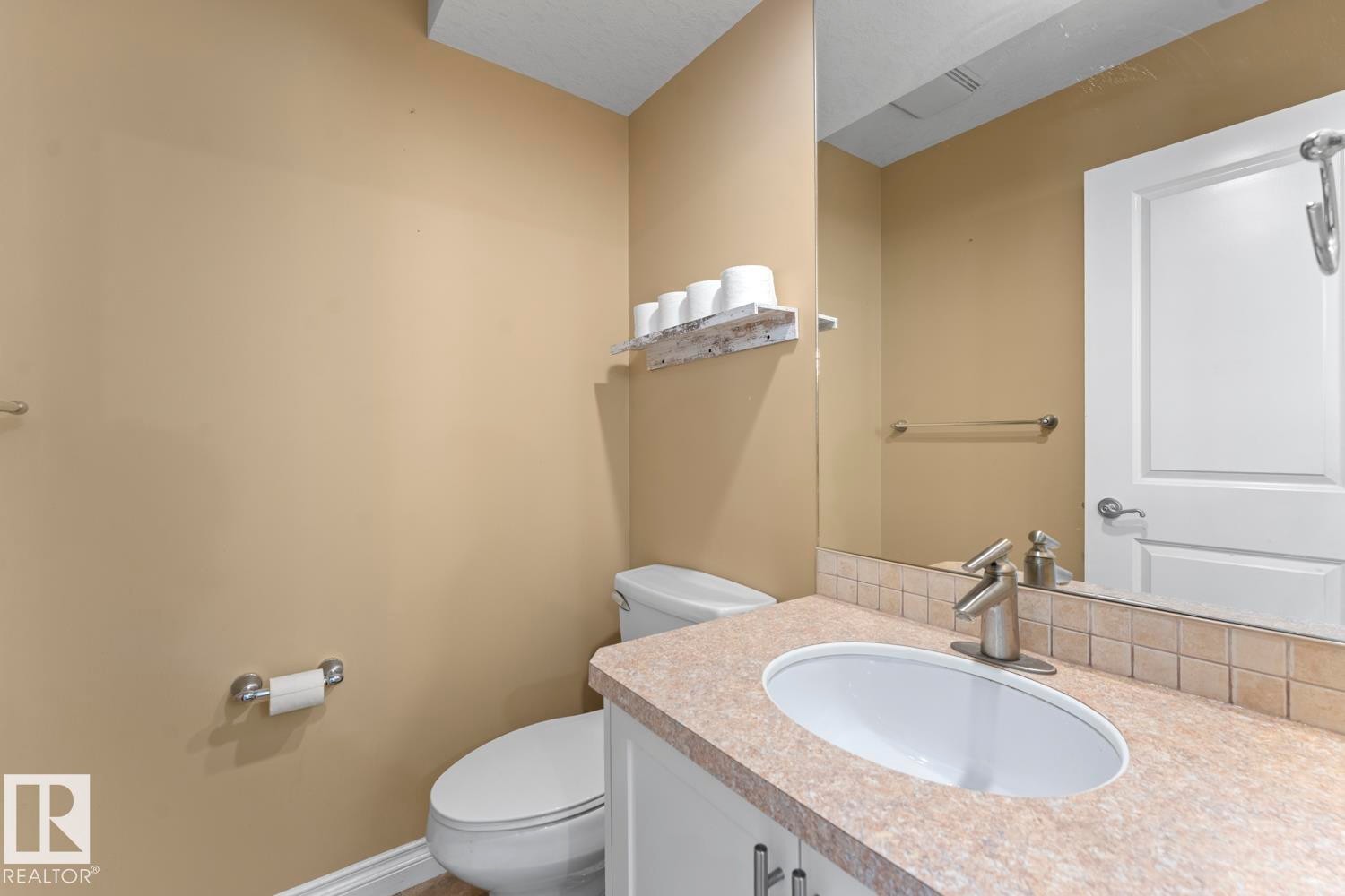Bathroom featuring vanity and toilet - 7 1001 7 Avenue, Cold Lake, AB - Indoor Photo Showing Bathroom