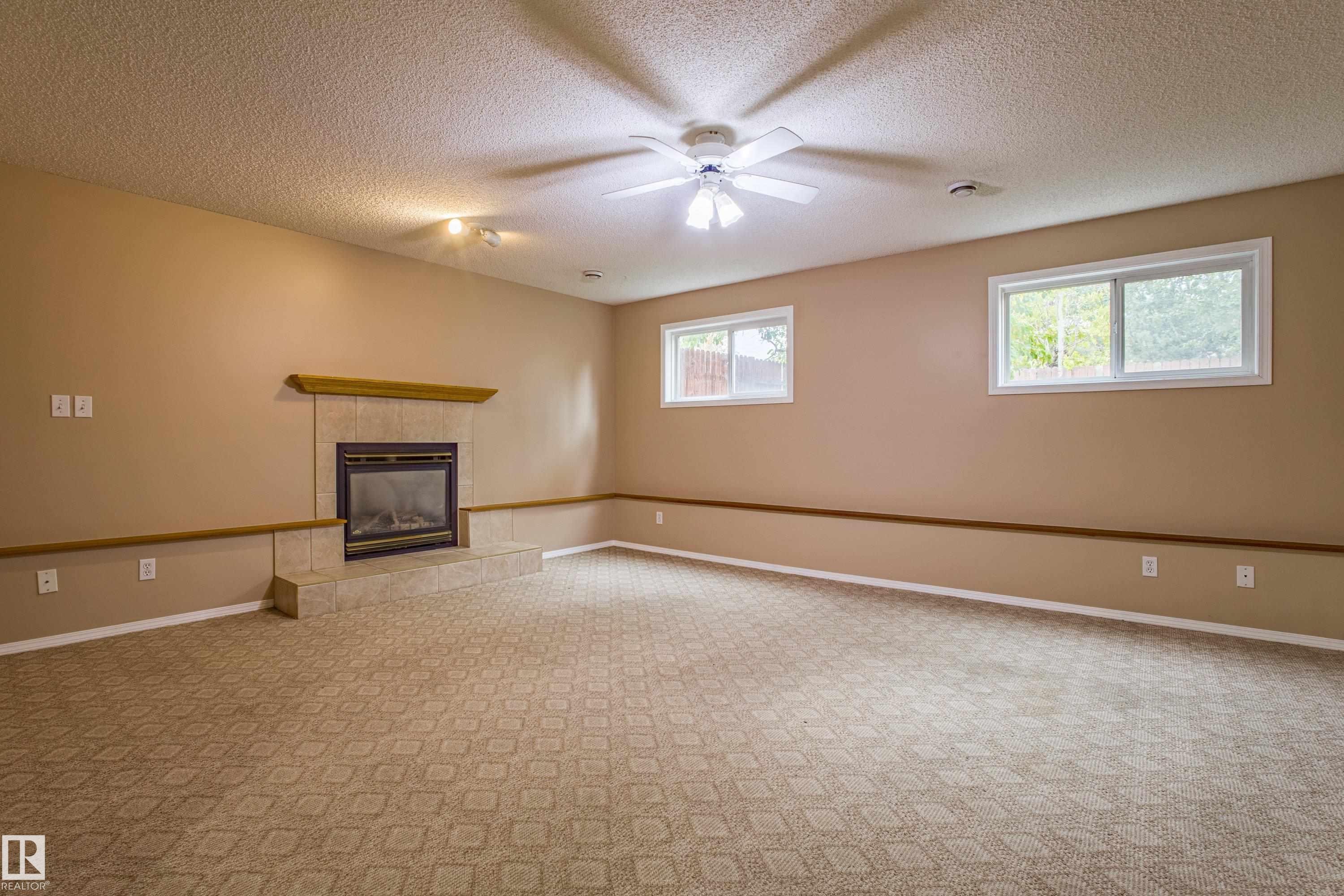 3835 47 Street, Edmonton, AB - Indoor Photo Showing Other Room With Fireplace