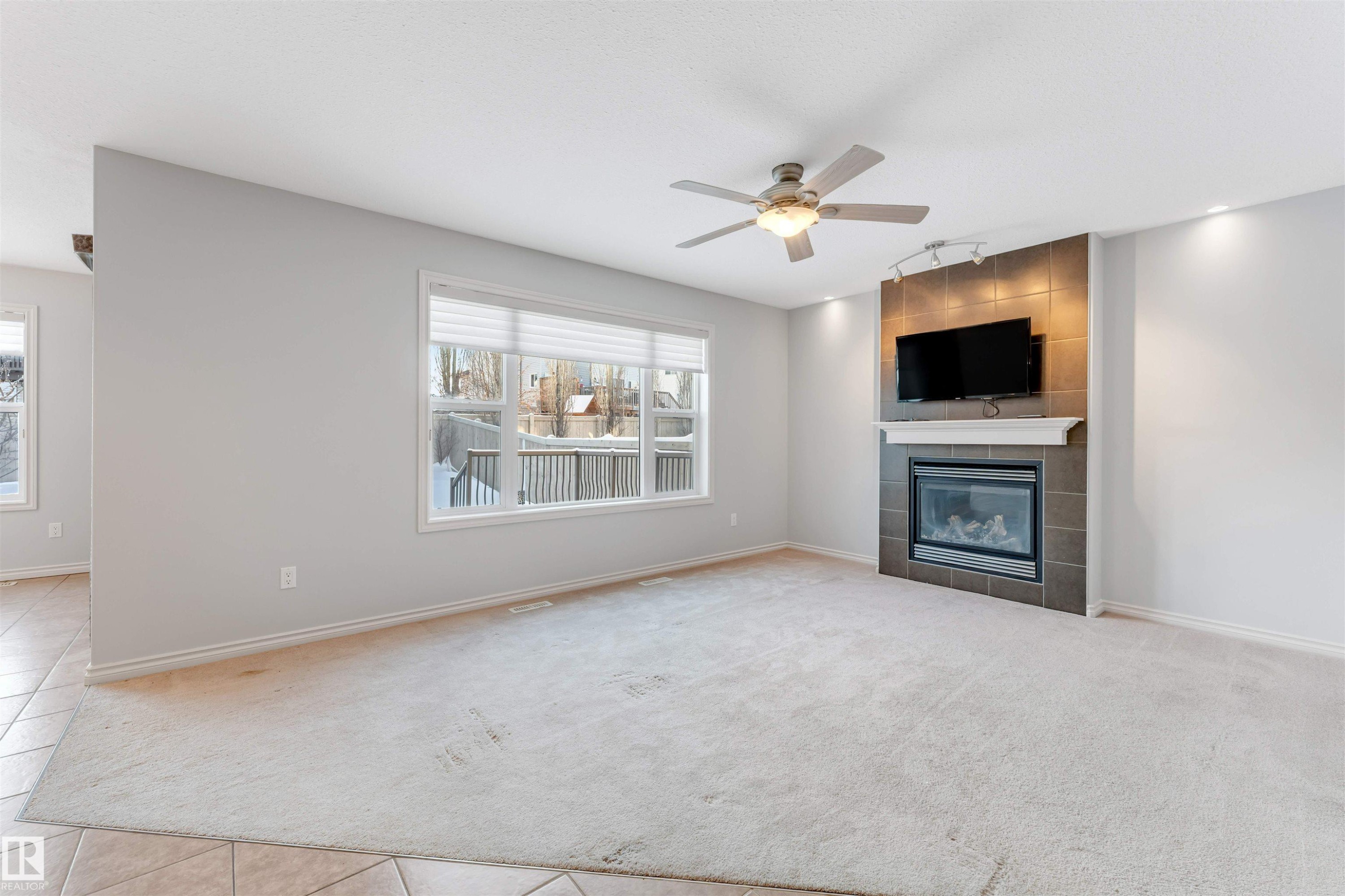 Edmonton, AB - Indoor Photo Showing Living Room With Fireplace