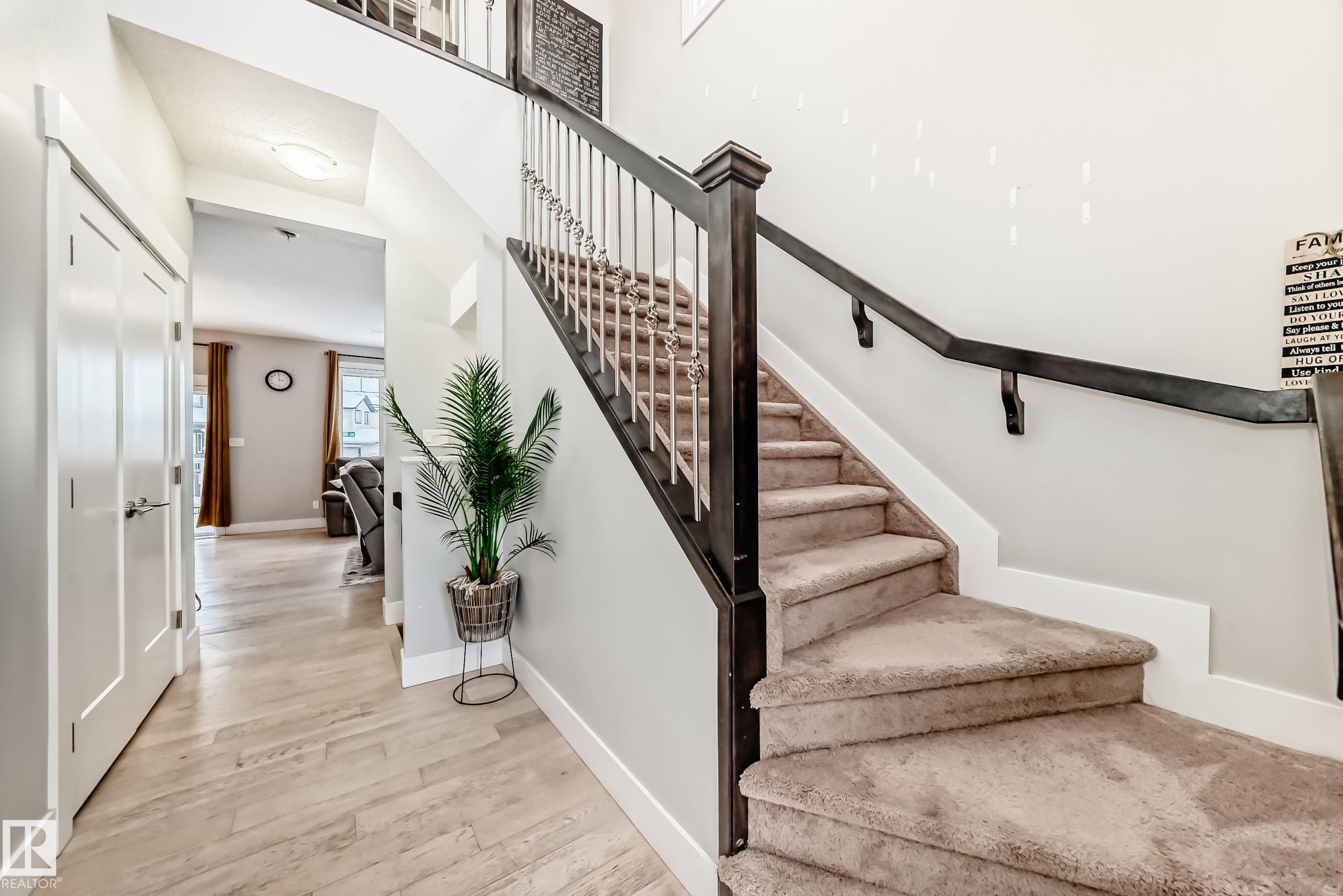 Stairs with wood finished floors and baseboards - 41 4835 Wright Drive, Edmonton, AB - Indoor Photo Showing Other Room