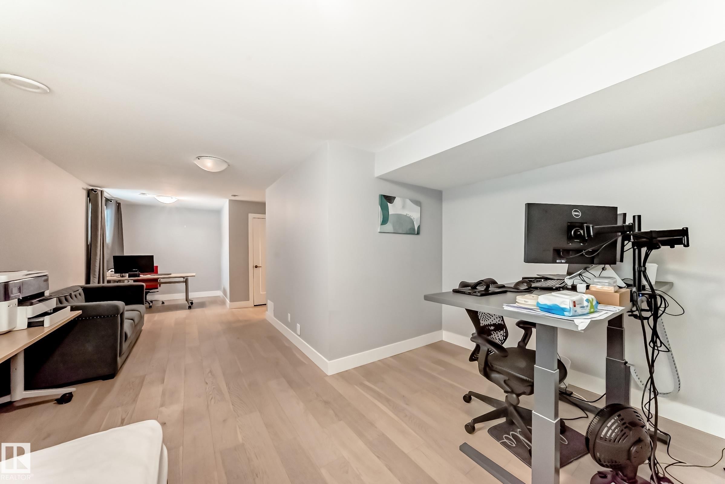 Office area with light wood-type flooring and baseboards - 41 4835 Wright Drive, Edmonton, AB - Indoor Photo Showing Office