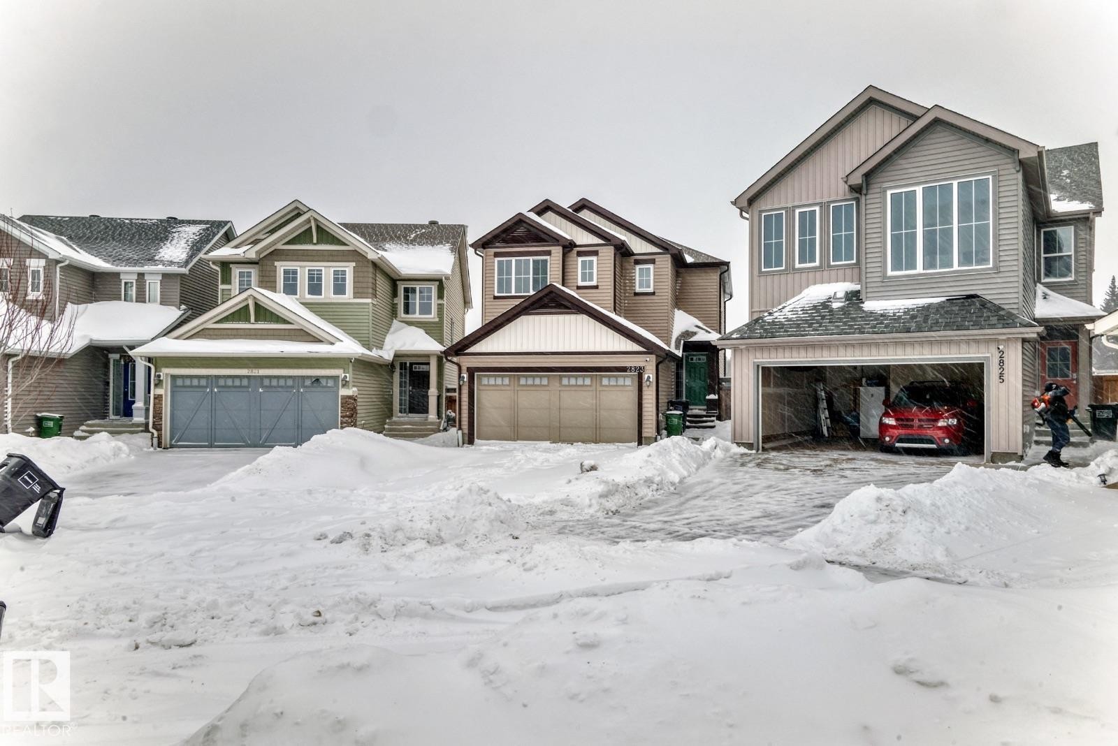 Craftsman-style home with a residential view and board and batten siding - 2823 Duke Crescent, Edmonton, AB - Outdoor With Facade