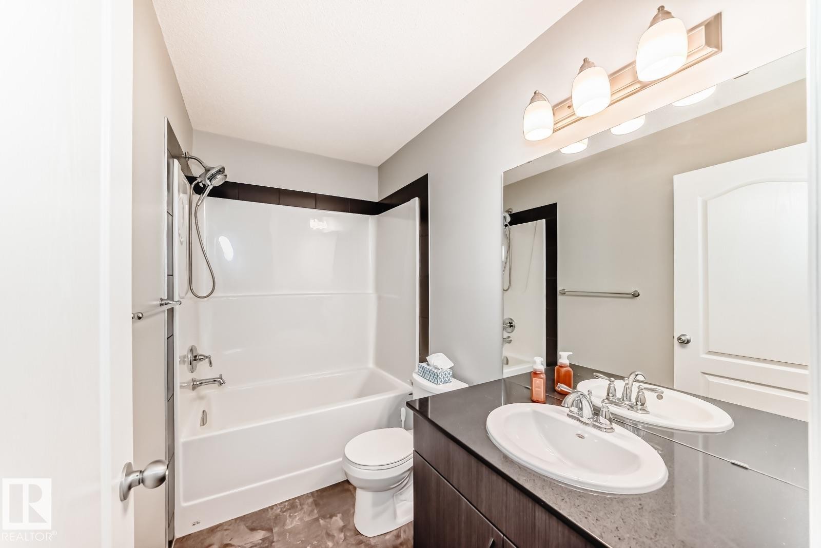 Full bathroom featuring vanity and tub / shower combination - 2823 Duke Crescent, Edmonton, AB - Indoor Photo Showing Bathroom