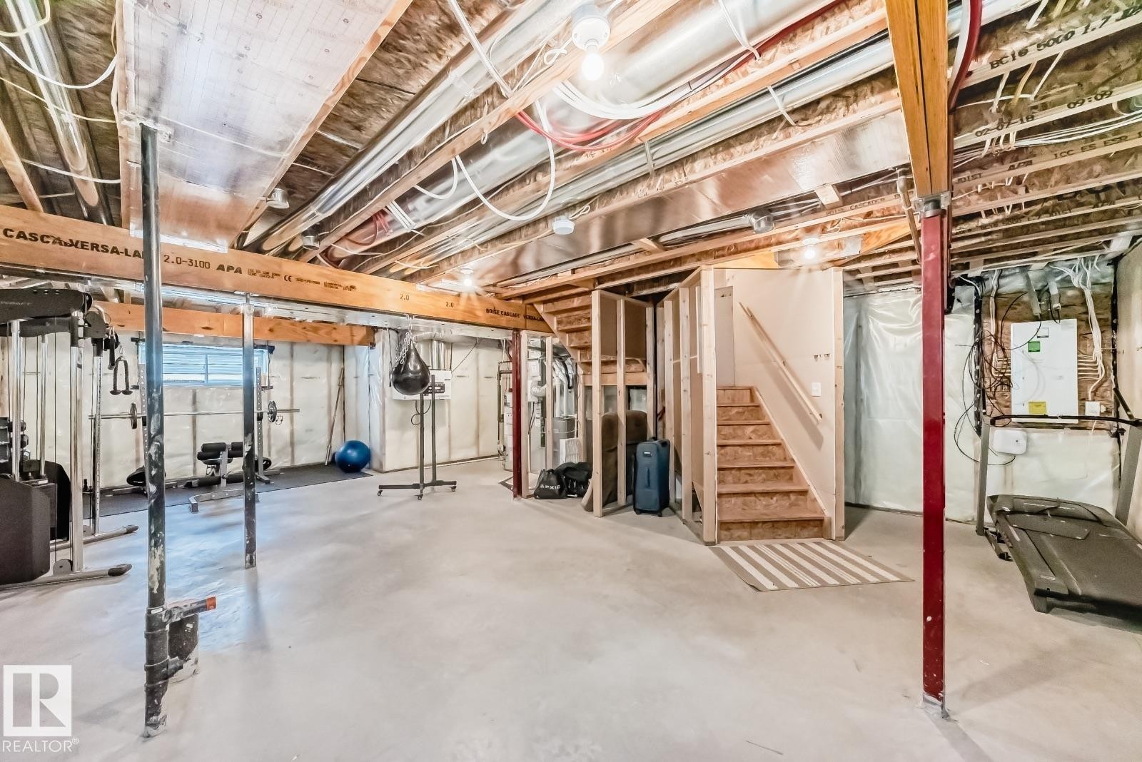 Unfinished below grade area with stairs and heating unit - 2823 Duke Crescent, Edmonton, AB - Indoor Photo Showing Basement
