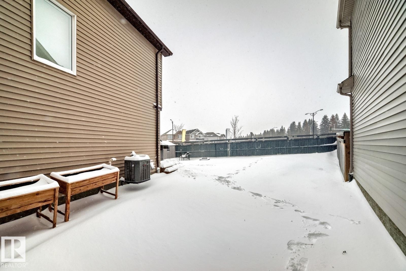 View of yard covered in snow - 2823 Duke Crescent, Edmonton, AB - Outdoor With Exterior