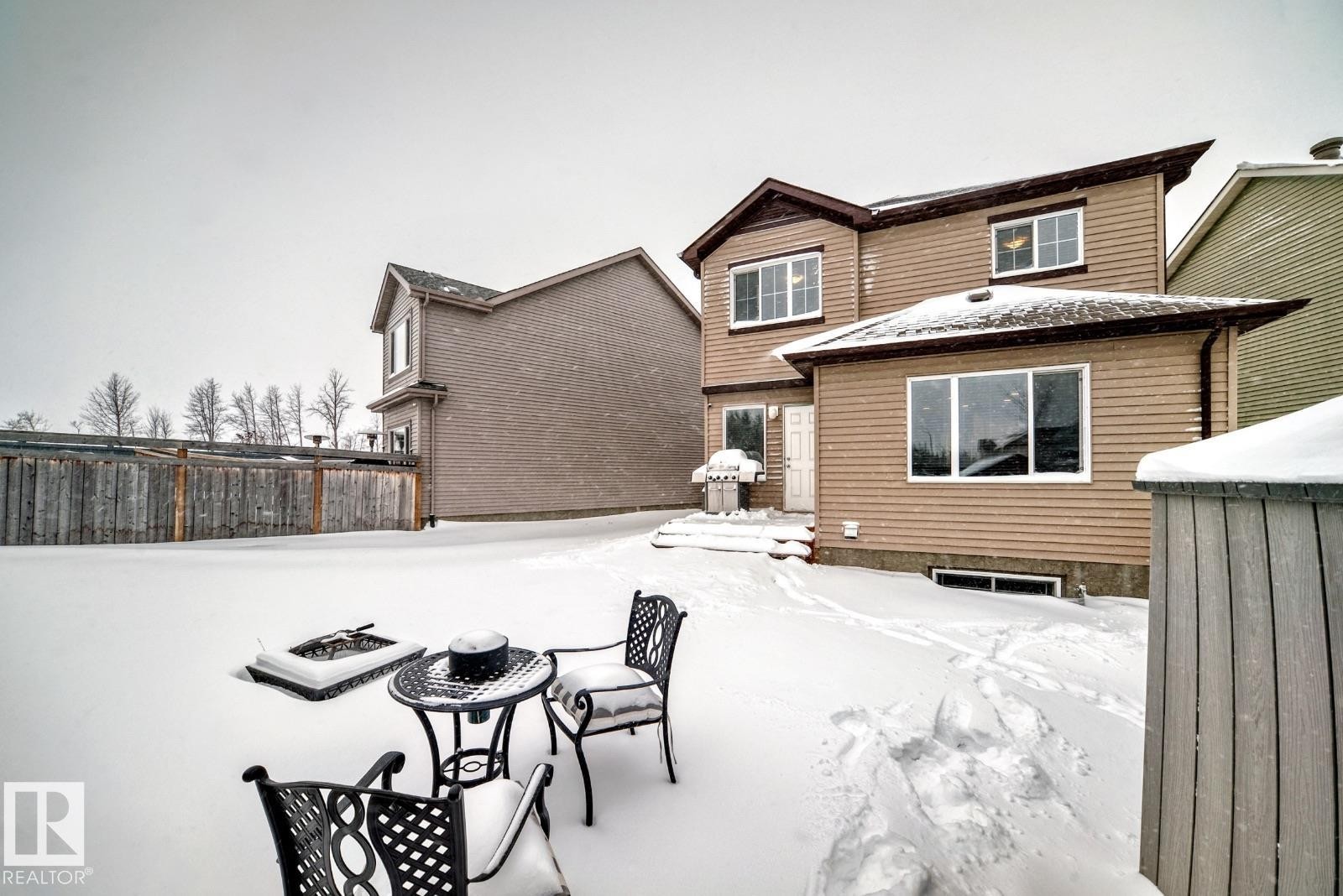 View of snow covered rear of property - 2823 Duke Crescent, Edmonton, AB - Outdoor With Exterior