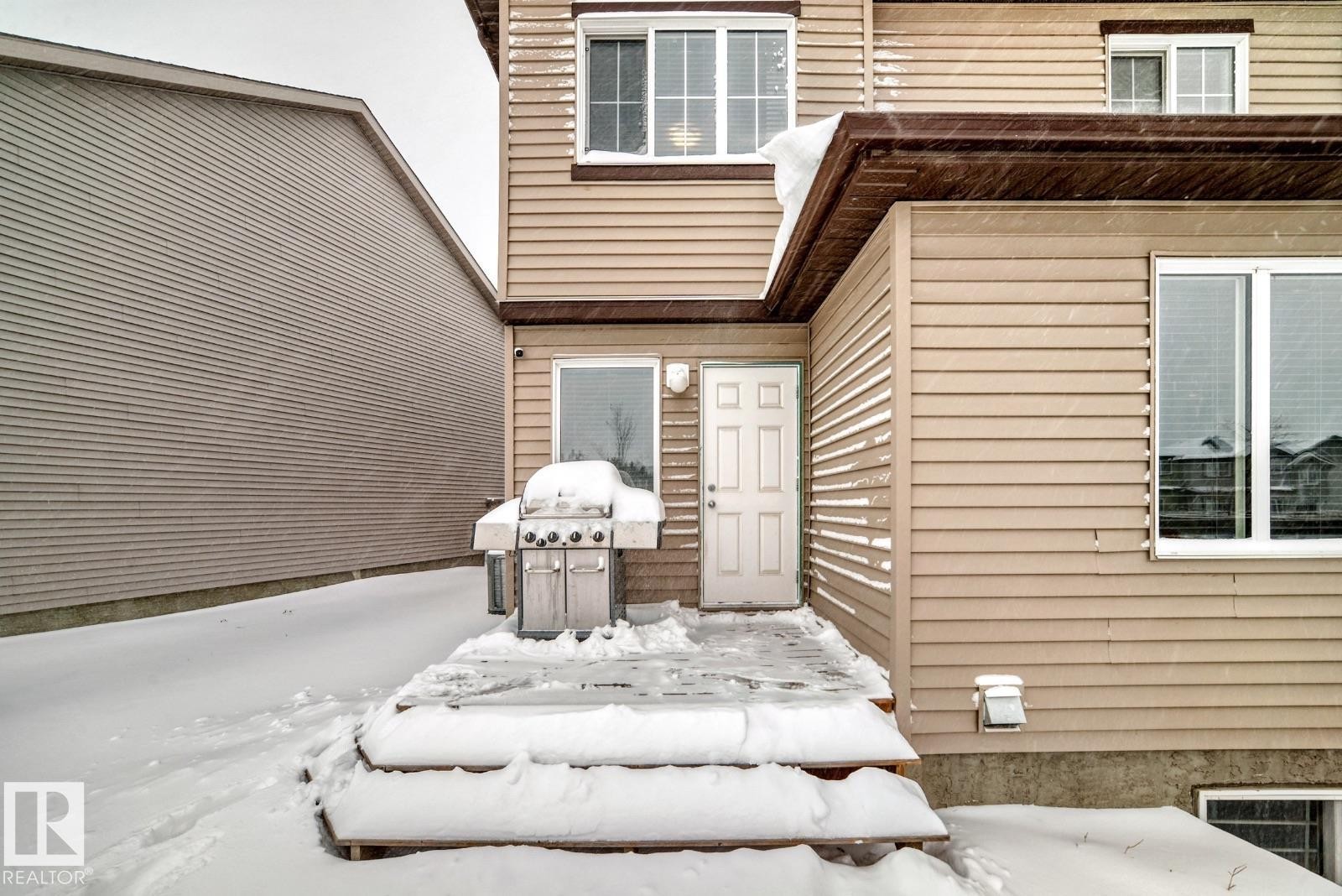 View of snow covered property entrance - 2823 Duke Crescent, Edmonton, AB - Outdoor With Exterior