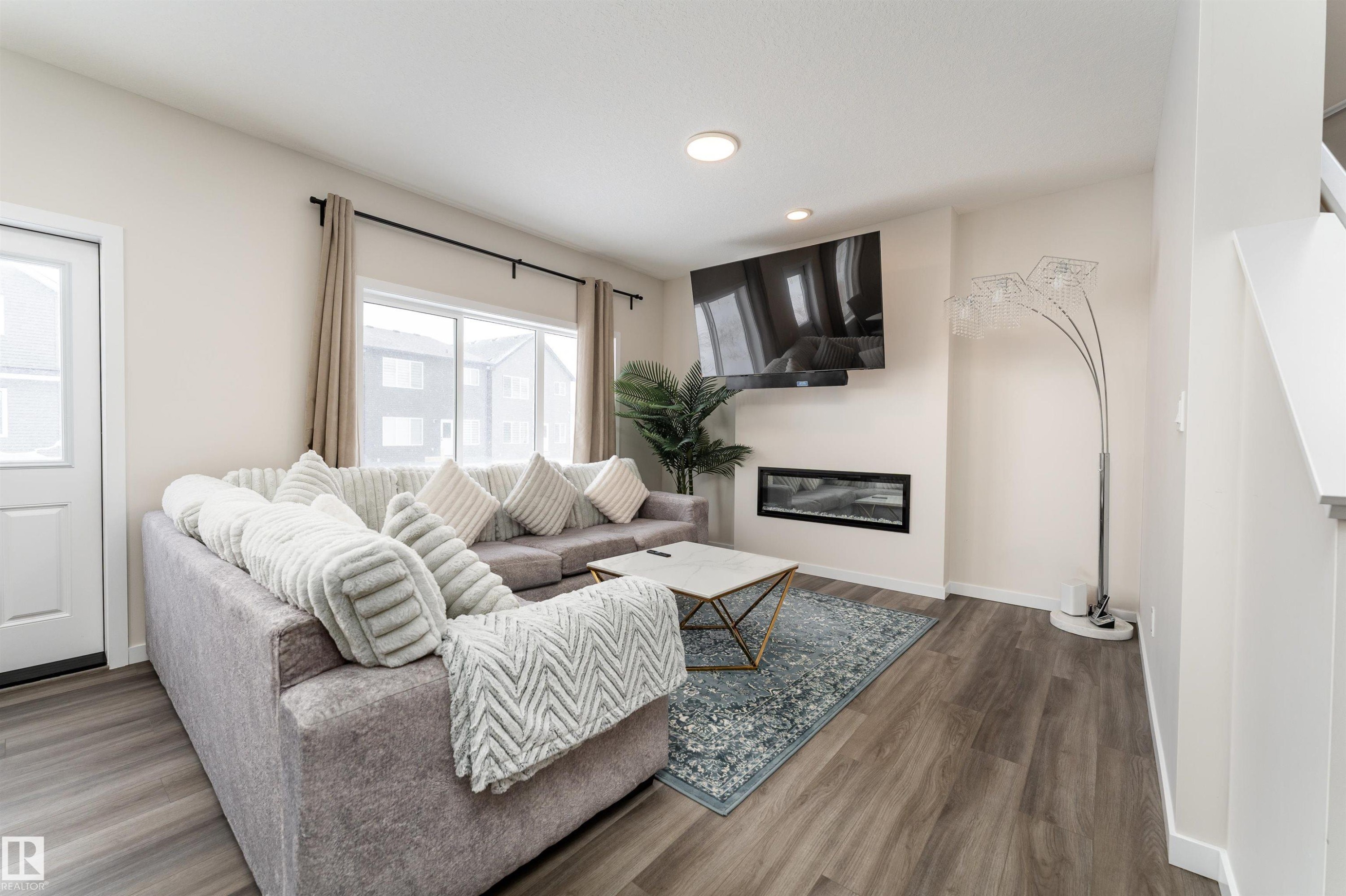 2120 Muckleplum Crescent, Edmonton, AB - Indoor Photo Showing Living Room With Fireplace