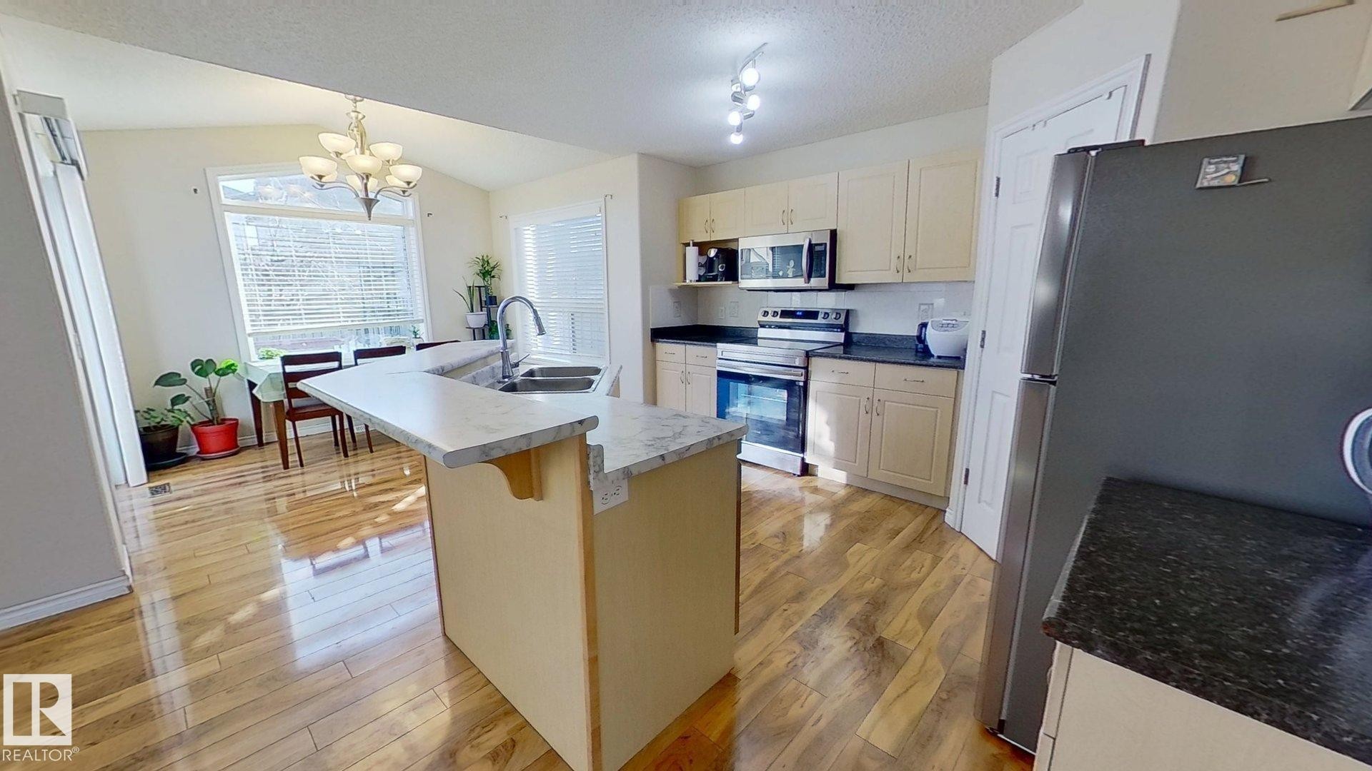 7376 Singer Way, Edmonton, AB - Indoor Photo Showing Kitchen With Double Sink