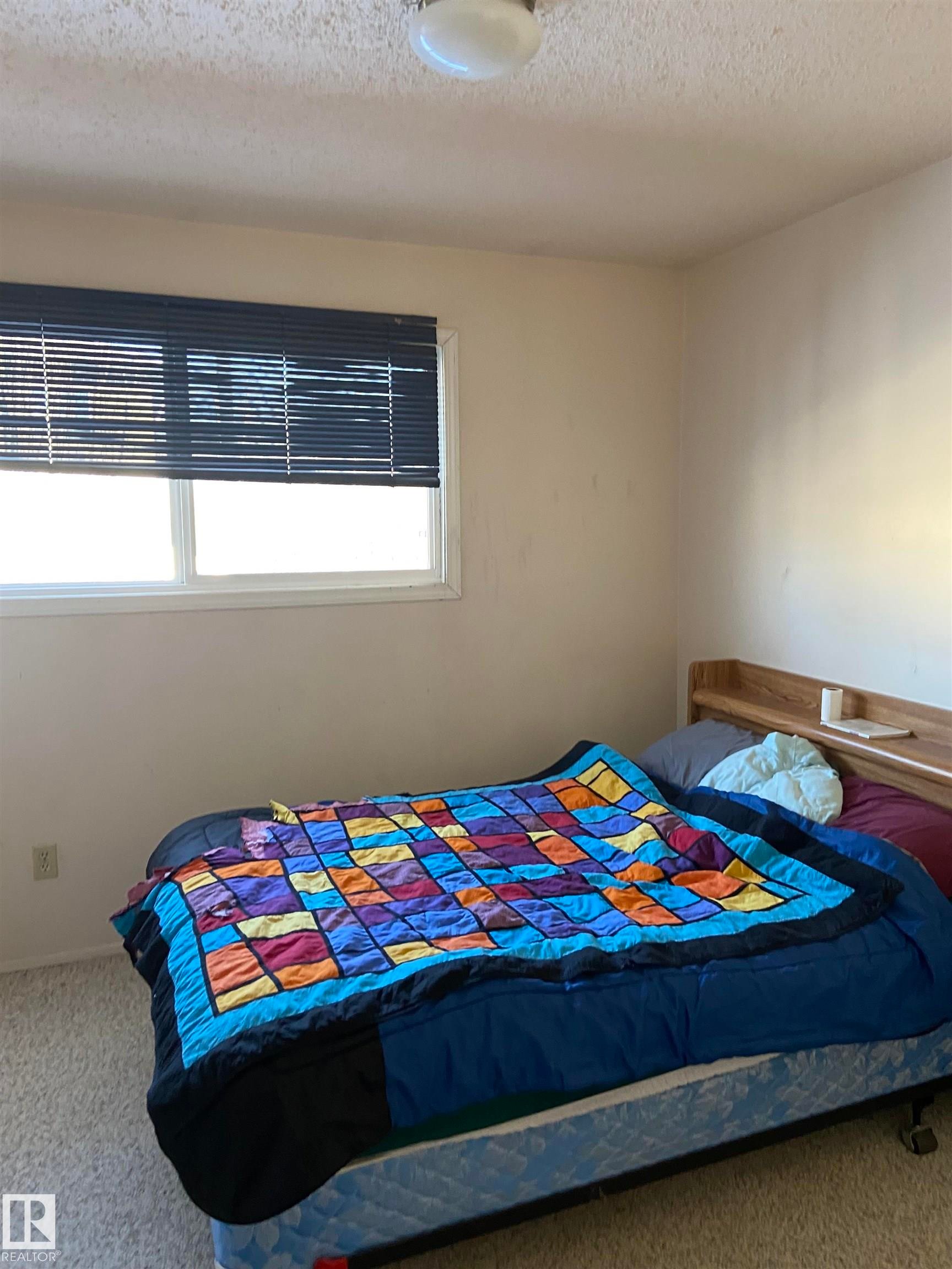 9 5325 48 Avenue, Redwater, AB - Indoor Photo Showing Bedroom