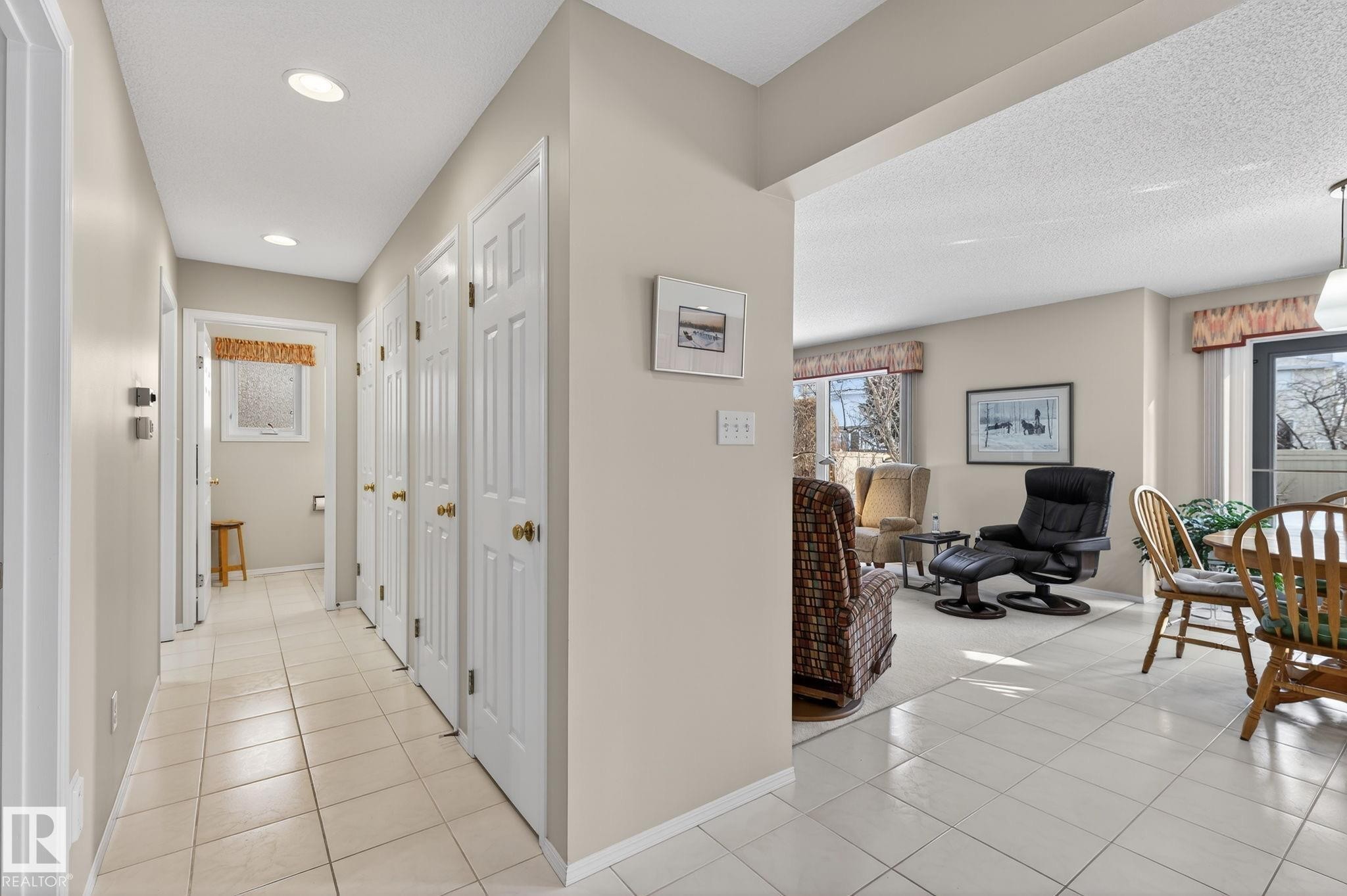 Hall featuring light tile patterned flooring - 313 Hedley Way, Edmonton, AB - Indoor Photo Showing Other Room