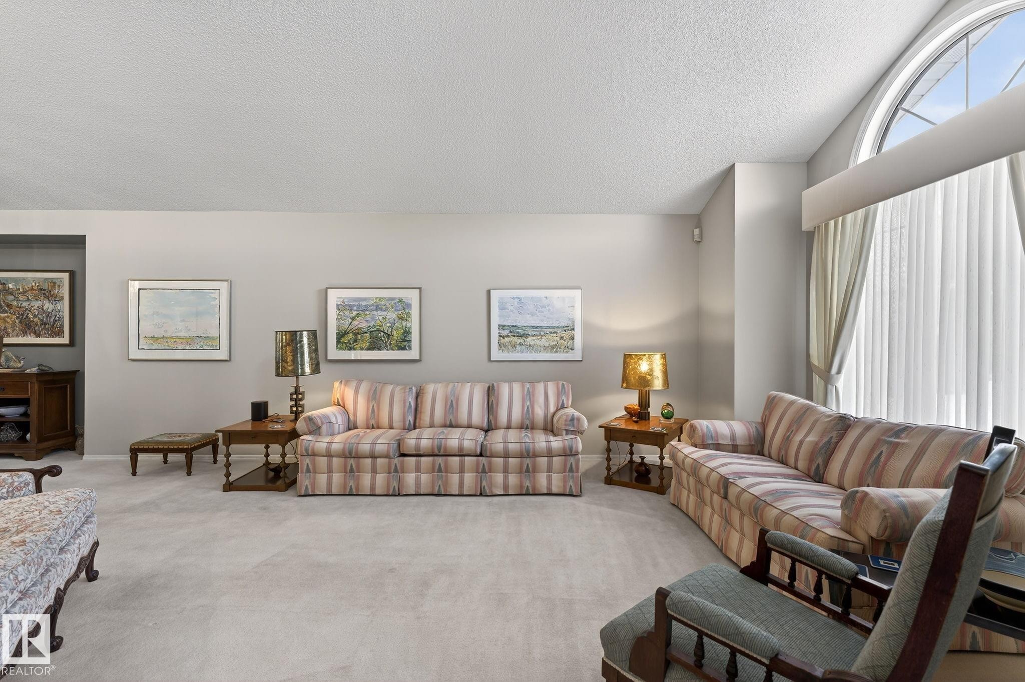 Carpeted living area with a textured ceiling - 313 Hedley Way, Edmonton, AB - Indoor Photo Showing Living Room