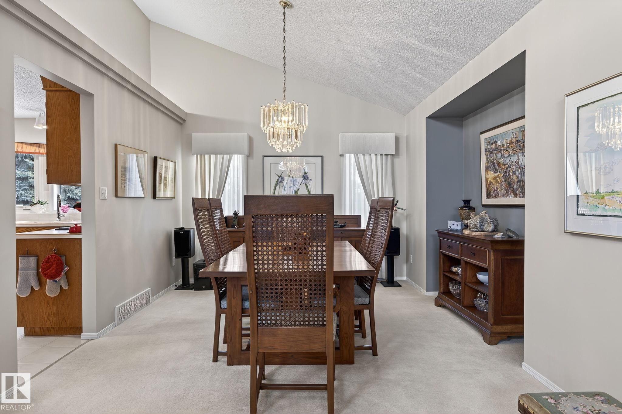 Dining room with light carpet and suspended lighting - 313 Hedley Way, Edmonton, AB - Indoor Photo Showing Dining Room