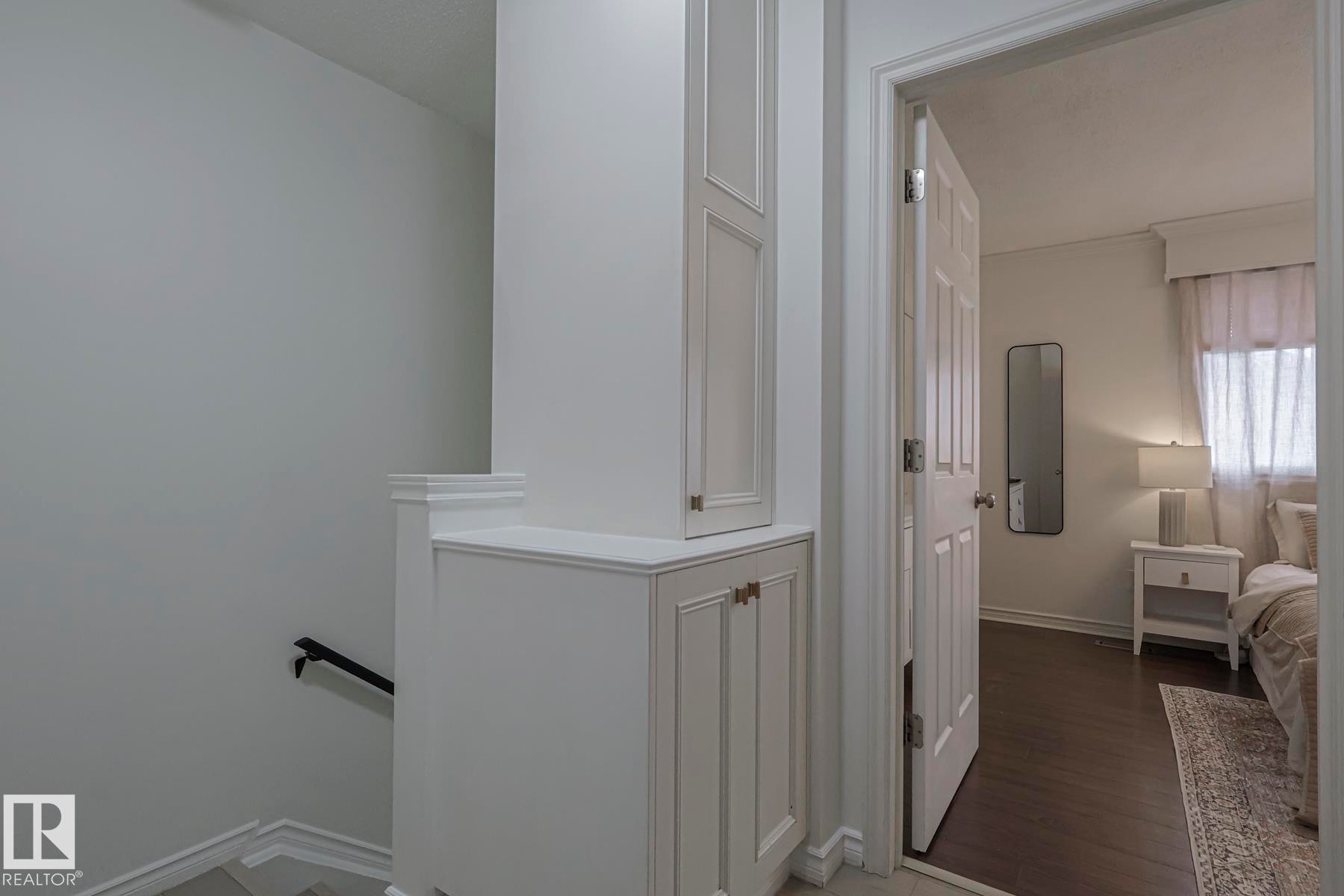 Hall featuring an upstairs landing and dark wood-style floors - 663 Abbottsfield Road, Edmonton, AB - Indoor Photo Showing Other Room