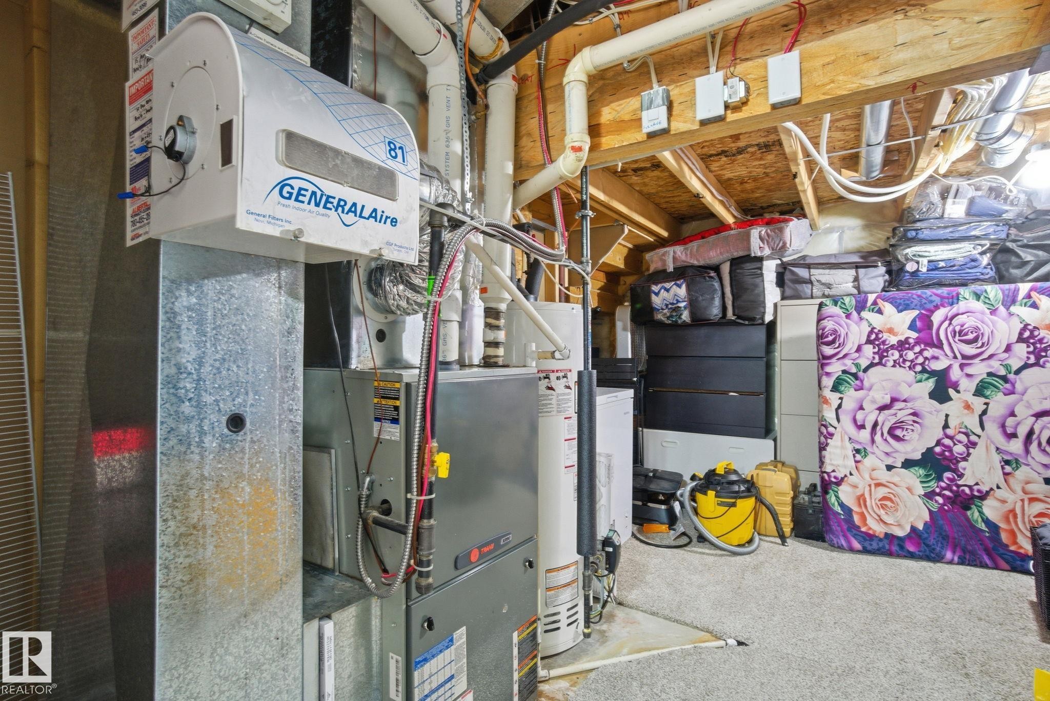 Utility room with heating unit and water heater - 1532 37C Avenue, Edmonton, AB - Indoor Photo Showing Basement
