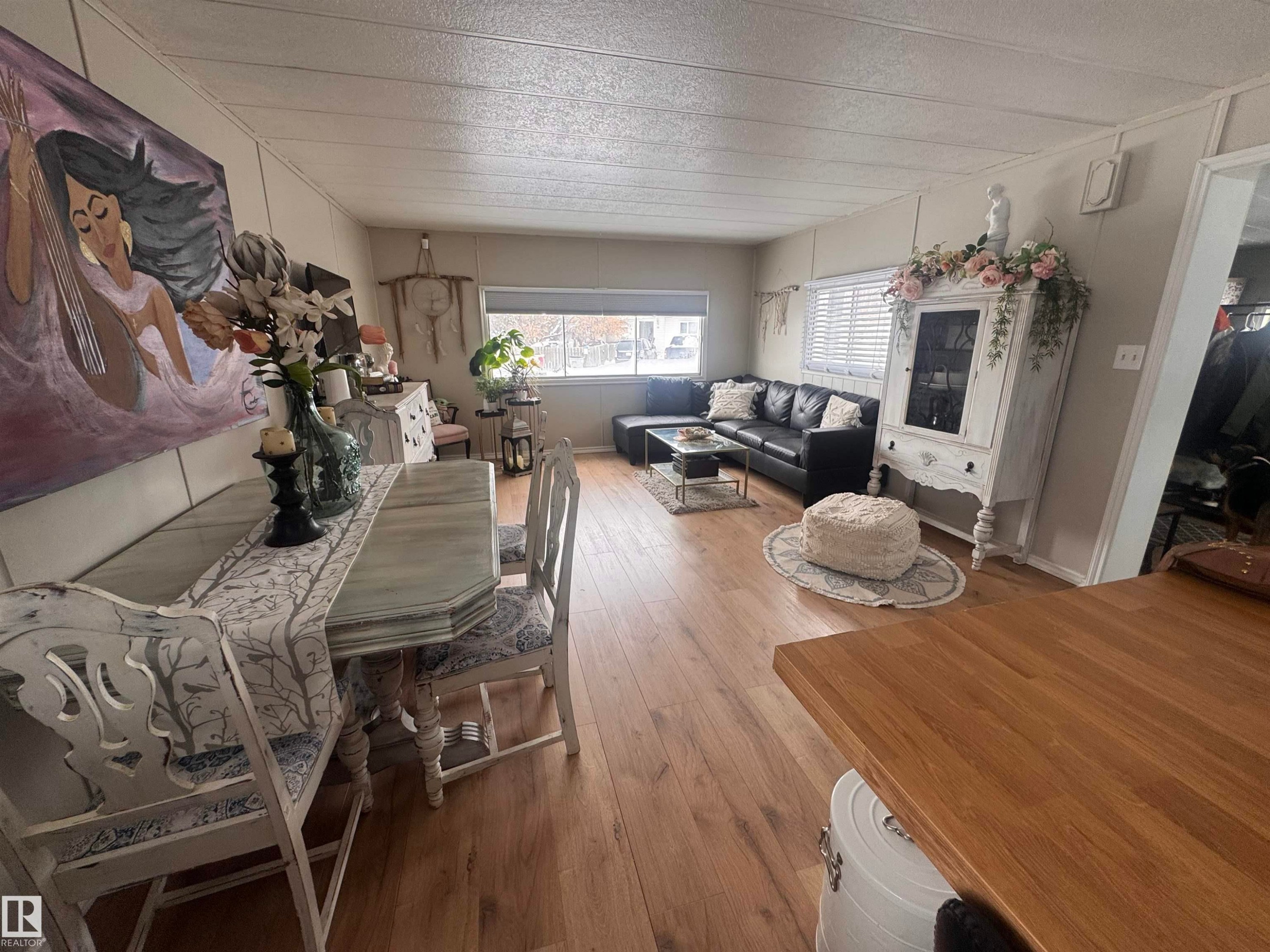Living room with hardwood / wood-style flooring - #44 9501 104 Ave, Westlock, AB - Indoor