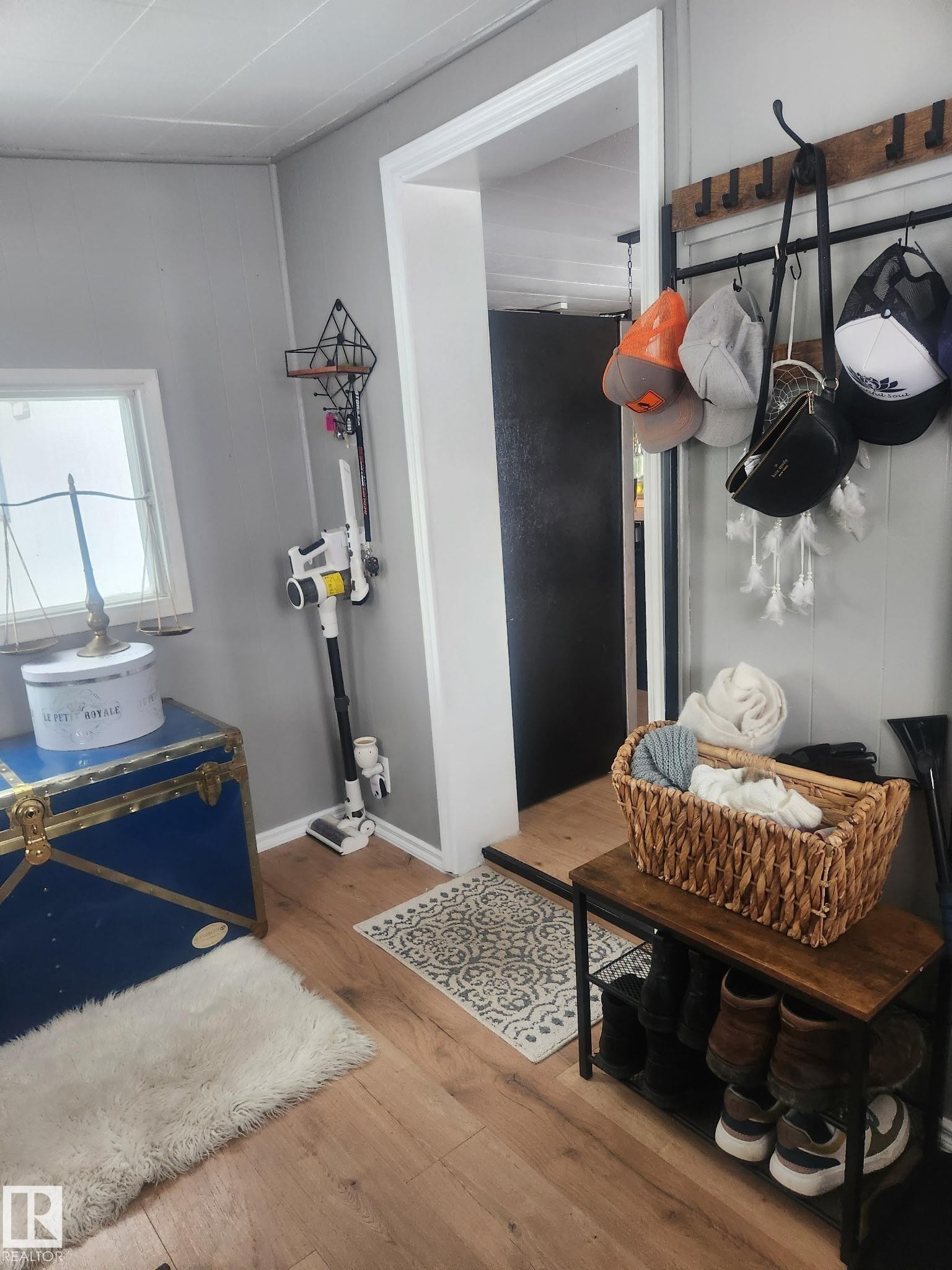 Mudroom with hardwood / wood-style flooring and baseboards - #44 9501 104 Ave, Westlock, AB - Indoor