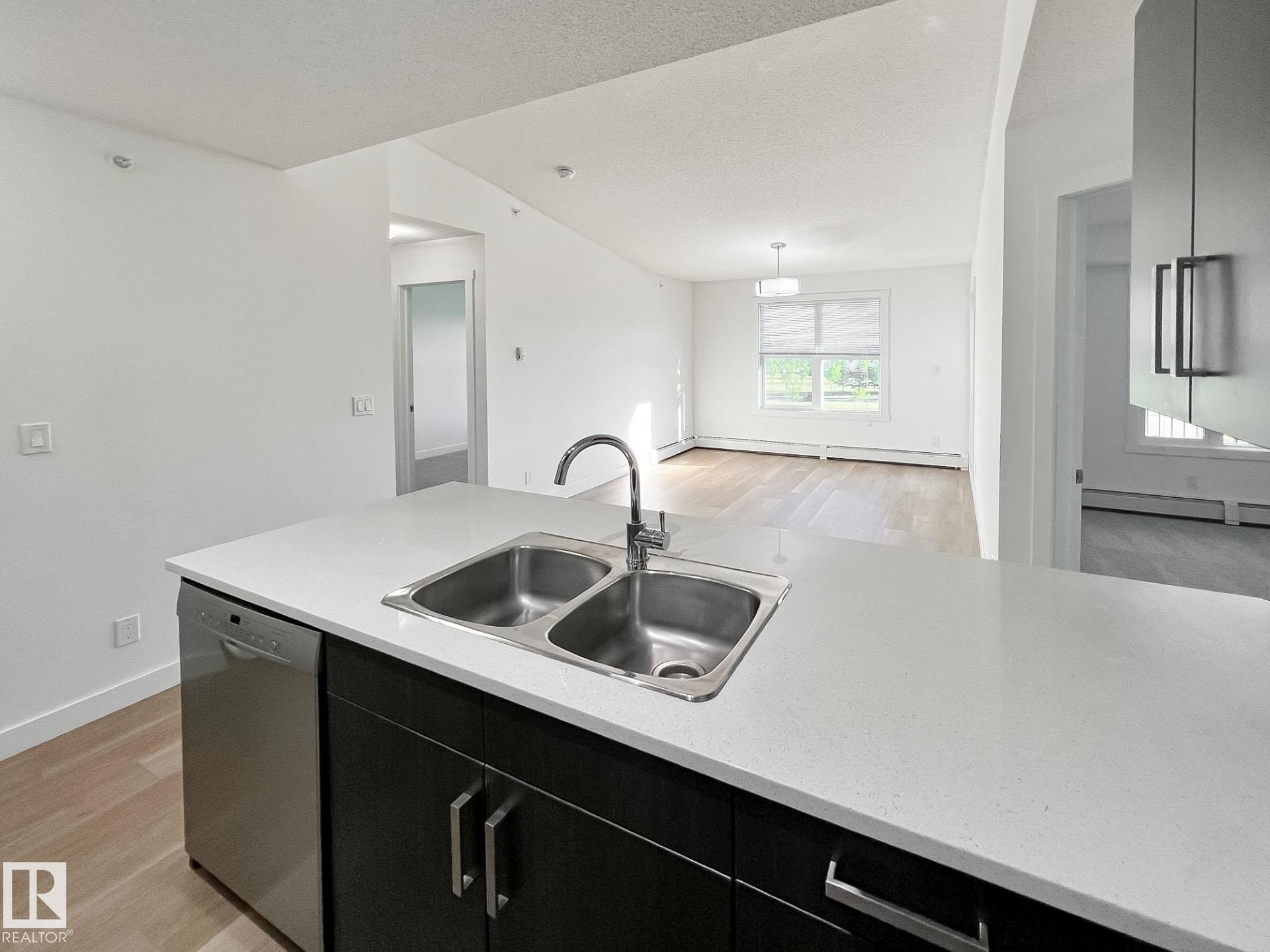 406 667 Watt Boulevard, Edmonton, AB - Indoor Photo Showing Kitchen With Double Sink