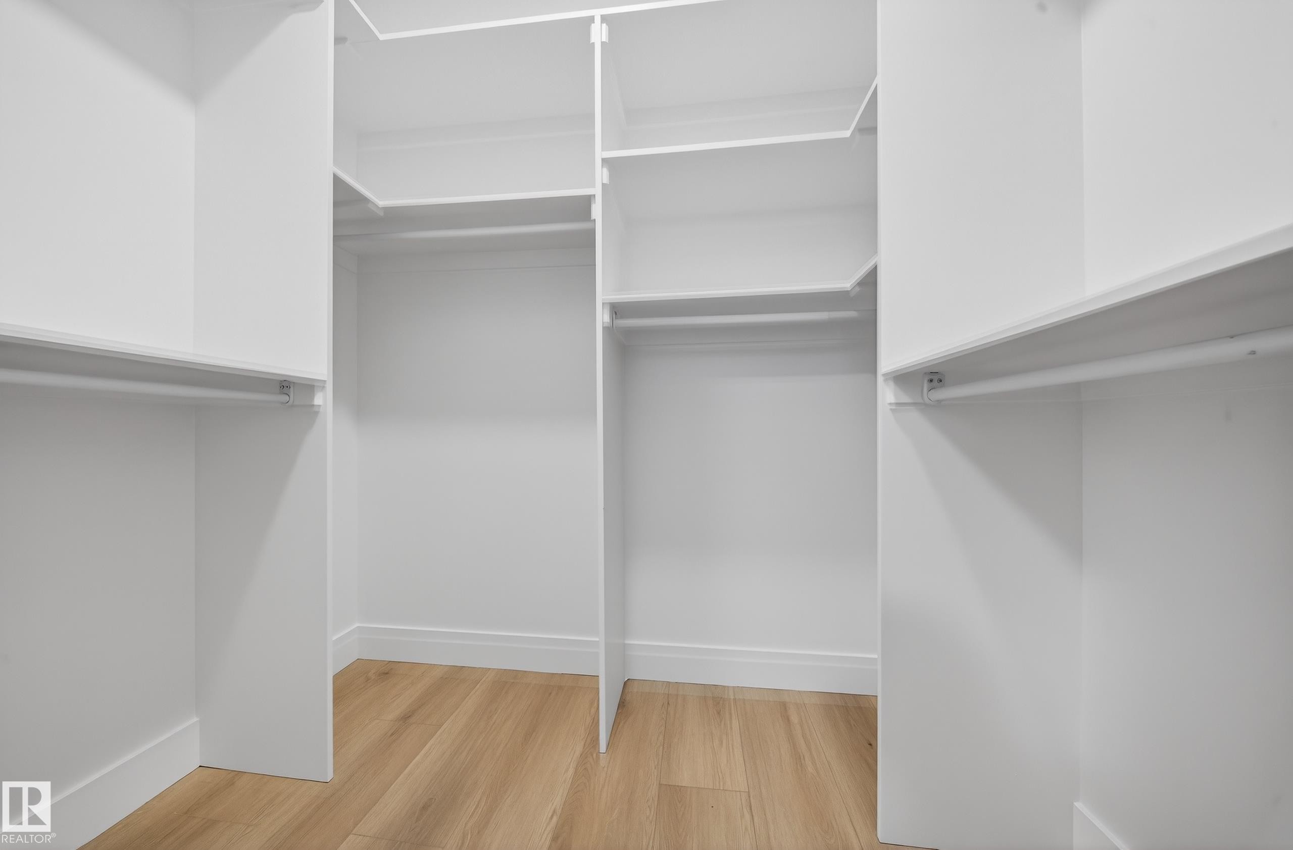 Walk in closet featuring light wood-style flooring - 9907 68 Street, Edmonton, AB - Indoor With Storage