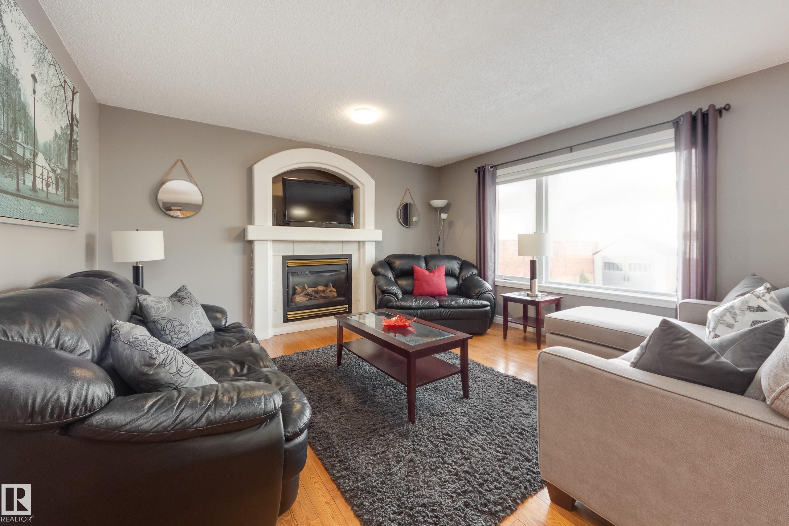 2844 40B Avenue, Edmonton, AB - Indoor Photo Showing Living Room With Fireplace