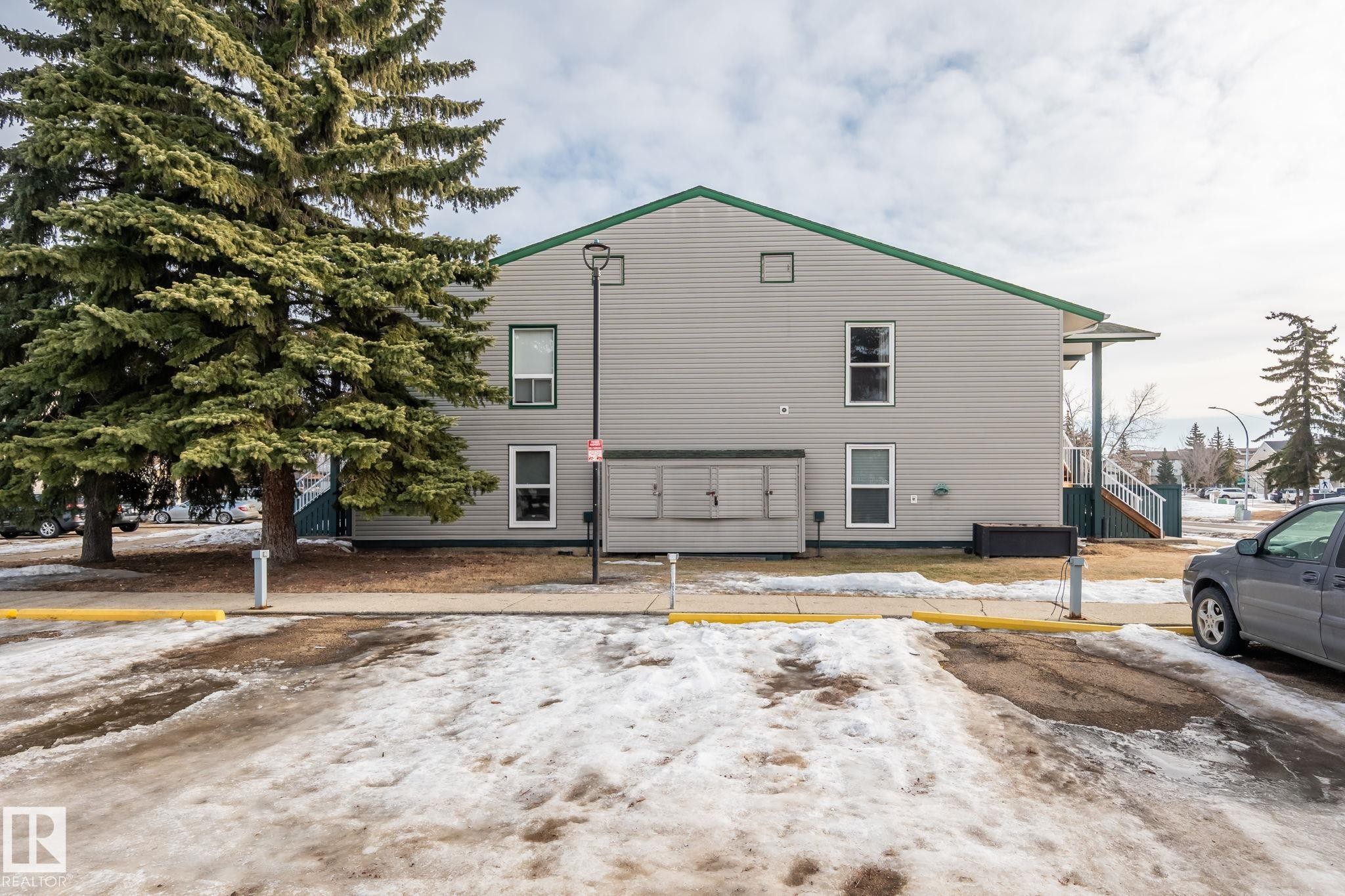 View of home's exterior featuring uncovered parking - 1925 Saddleback Road, Edmonton, AB - Outdoor